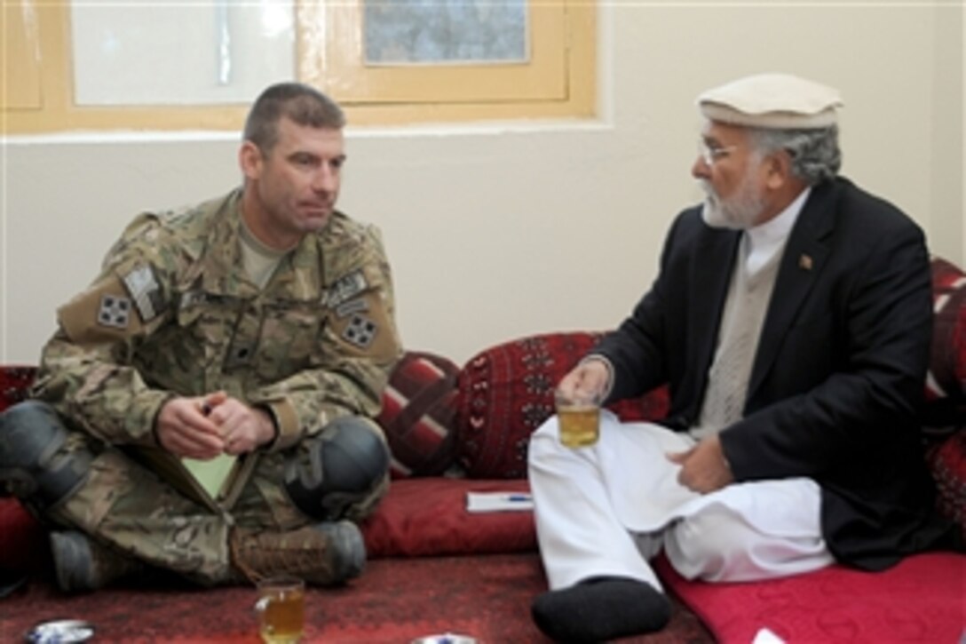 U.S. Army Lt. Col. Brian Pearl, commander of 2nd Battalion, 12th Infantry Regiment, talks with Kunar provincial Gov. Fazlullah Wahidi before a district shura at the Chapa Dara district center in Kunar province, Afghanistan, on Jan. 4, 2010.  Pearl and Wahidi visited the Chapa Dara, Manogai and Watapur districts to meet with district sub-governors, line directors, village elders and shura members to better connect the provincial government with district governments.  A few key issues addressed during the visits were a new budgeting process and reconciliation.  
