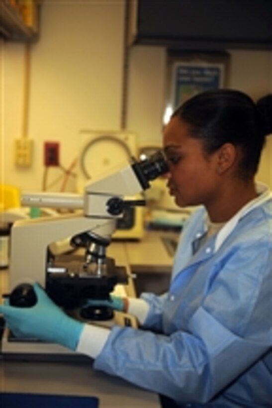 U.S. Air Force Staff Sgt. Adrienne Antonios, a 4th Medical Operations Squadron medical lab technician, uses a microscope to check a fluid sample for blood at Seymour Johnson Air Force Base, N.C., on Jan. 5, 2010.  Medical laboratory technicians process and perform analytical procedures on blood, urine and other body fluids daily.  