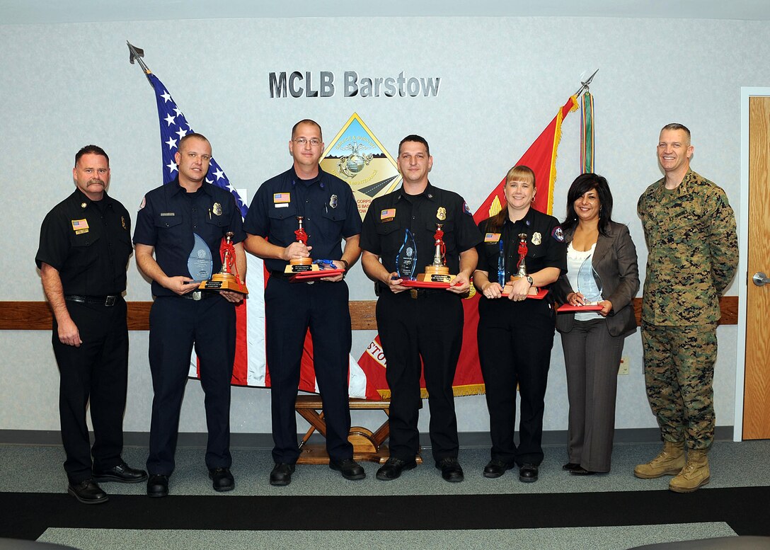 Marine Corps Logistics Base Barstow commanding officer Col. Daniel Ermer (far right) poses with the yearly Fire Award winners from the DOD award-winning MCLBB Fire and Emergency Services Division, who received recognition for going above and beyond their normal duties during 2009.