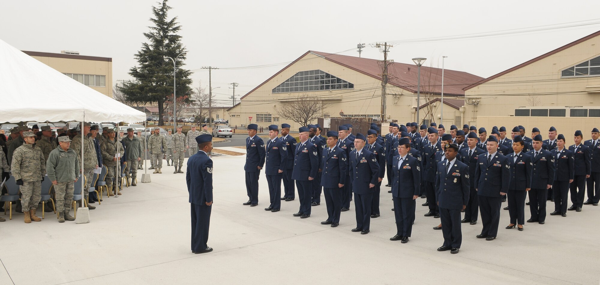 YOKOTA AIR BASE, Japan -- A formation of enlisted Airmen recite the Airman's Creed Dec. 12 during the opening ceremony of the Professional Development Center. The new building offers bigger classrooms, more amenities, and a better location for students. (U.S. Air Force photo/Airman 1st Class Sean Martin) 