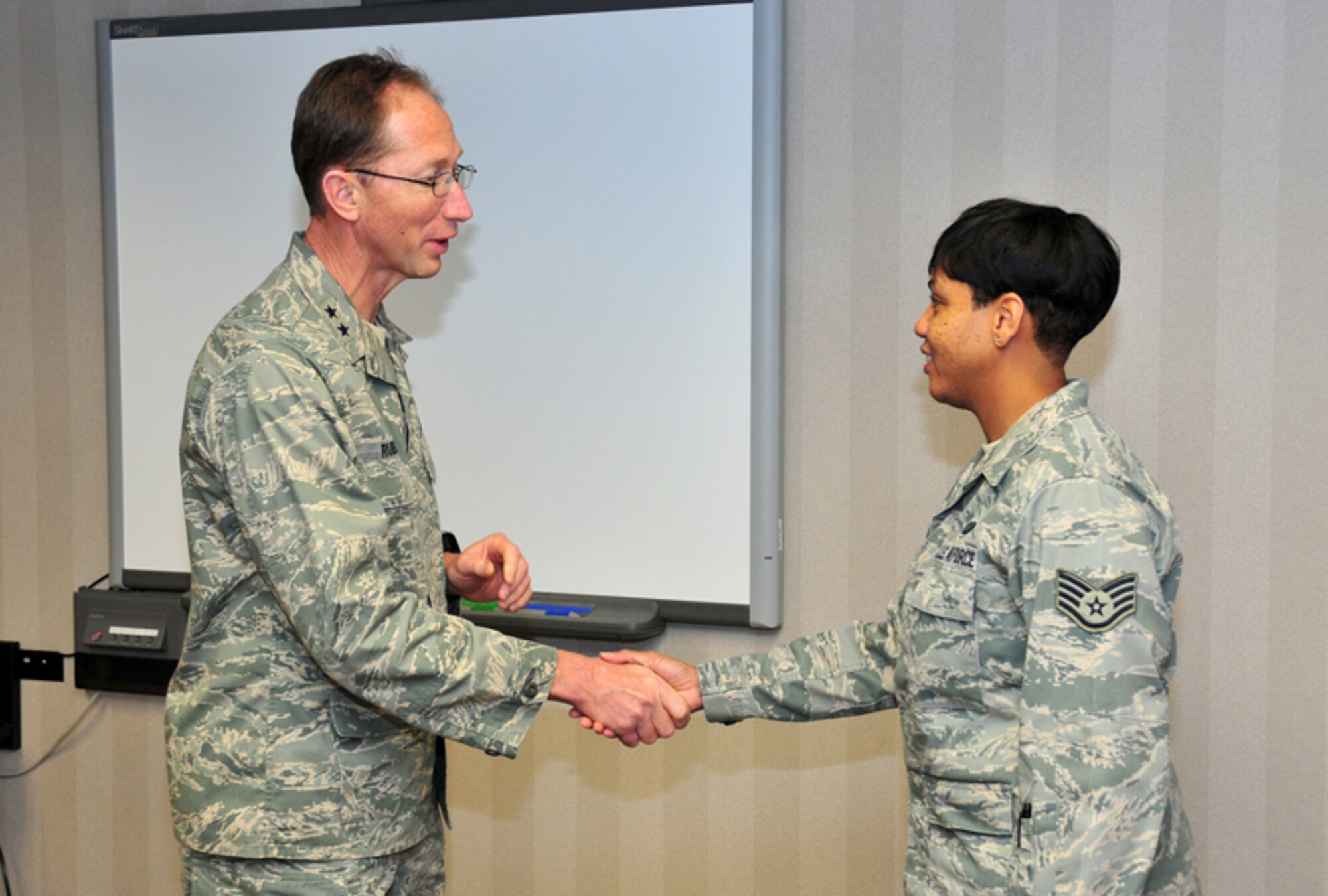 Maj. Gen. James T. Rubeor, commander, 22nd Air Force presents his Commander’s Coin to Staff Sgt. Adrian M. Willis, air reserve technician, 94th Security Forces Squadron Commander’s Support Staff for outstanding performance Jan. 9. General Rubeor visited the Airmen of the 94th SFS during their Unit Training Assembly as part of his commitment to visit every unit in the 22nd Air Force and ensure everyone has the necessary facilities and training they need to complete their mission. (U.S. Air Force photo: Tech. Sgt. Nicholas Ontiveros)