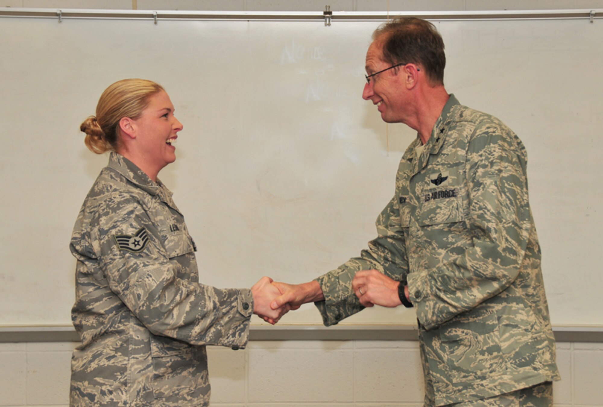 Maj. Gen. James T. Rubeor, commander, 22nd Air Force presents his Commander’s Coin and a Certificate of Recognition from the Air Mobility Command Office of the Inspector General to Staff Sgt. Heather A. Leonnig, readiness specialist, 94th Civil Engineering Squadron Jan. 9. The 94th CES Chemical, Biological, Radiological and Nuclear reconnaissance Team was recognized outstanding performance during the AMC Operational Readiness inspection conducted Dec. 11, 2009. (U.S. Air Force photo: Tech. Sgt. Nicholas Ontiveros)