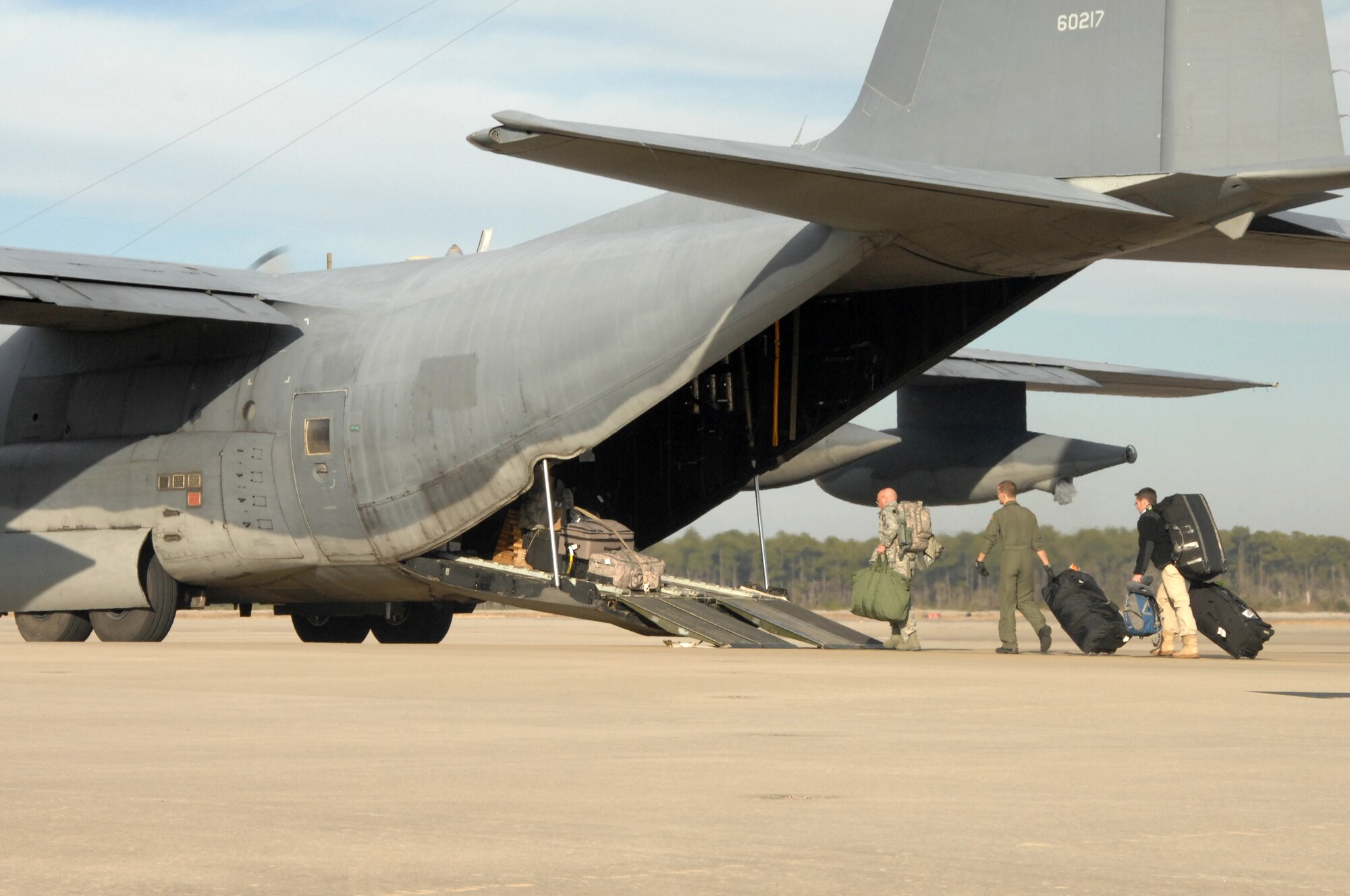 Air Force Special Operations Command Airmen load onto an MC-130H Combat Talon II before departing for Haiti, Jan. 13, 2010.  These Airmen will participate in the U.S. humanitarian assistance and disaster relief mission in Haiti. (U.S. Air Force photo by Senior Airman Matthew Loken/Released)