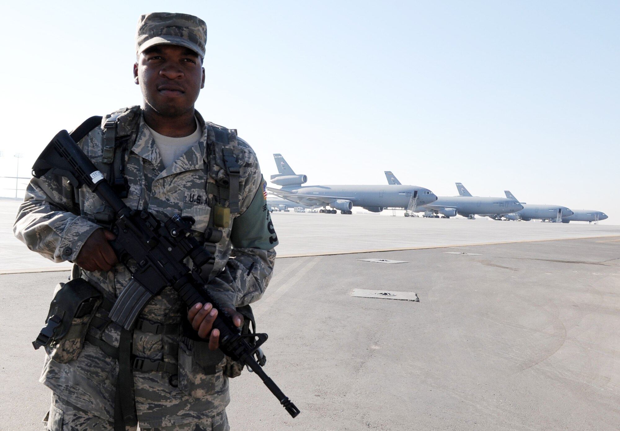 Airman 1st Class William Hollinger, 380th Expeditionary Security Forces Squadron, watches over the flightline Jan. 8, 2010 at an air base in Southwest Asia.  Airman Hollinger is deployed from the 21st Security Forces Squadron and his hometown is Norfolk, Va.  (U.S. Air Force photo/Tech. Sgt. Scott T. Sturkol)