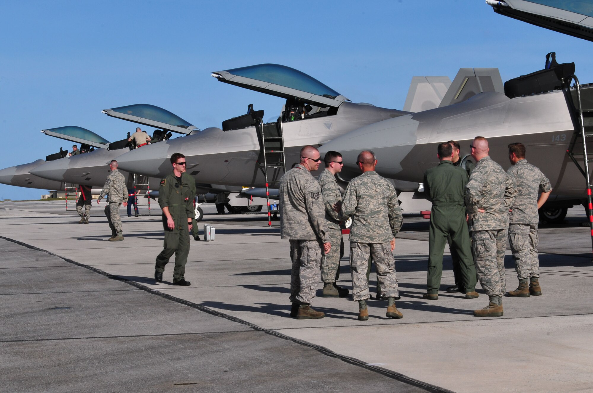 Members of the 36th Wing welcome the crew and pilots of F-22 Raptors to Andersen Air Force Base, Guam, Jan. 13. 2010. The Raptors are assigned to the 90th Fighter Squadron at Elmendorf AFB, Alaska, and are forward deployed to support the Theater Security Packages in the Pacific region.  (U.S. Air Force photo/Airman 1st Class Julian North)