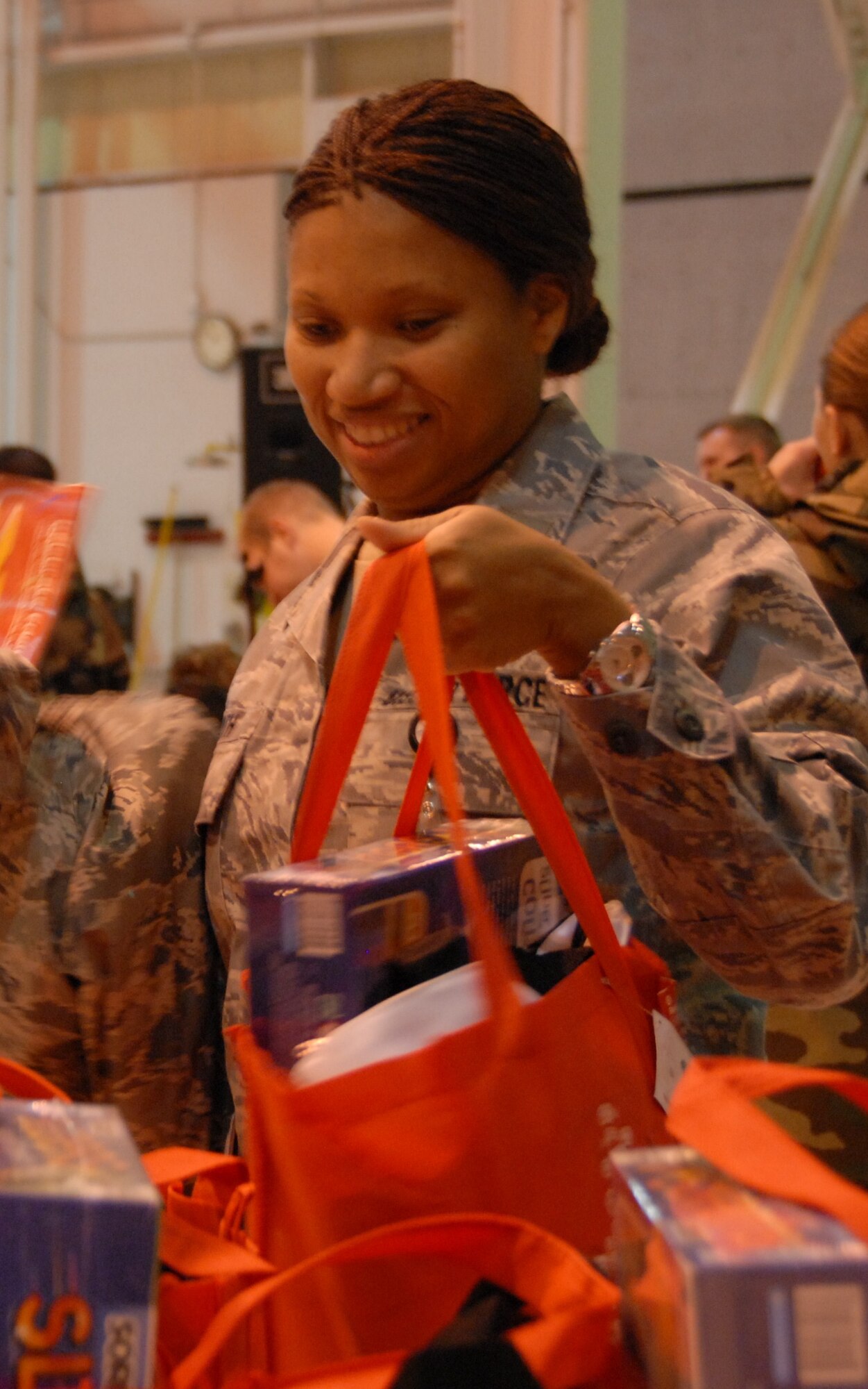 2nd Lt. Ellisha Smith receives a gift bag from Blue Star Families during the 190th Holiday Party in December 2009. (photo by Staff Sgt. Emily Alley)