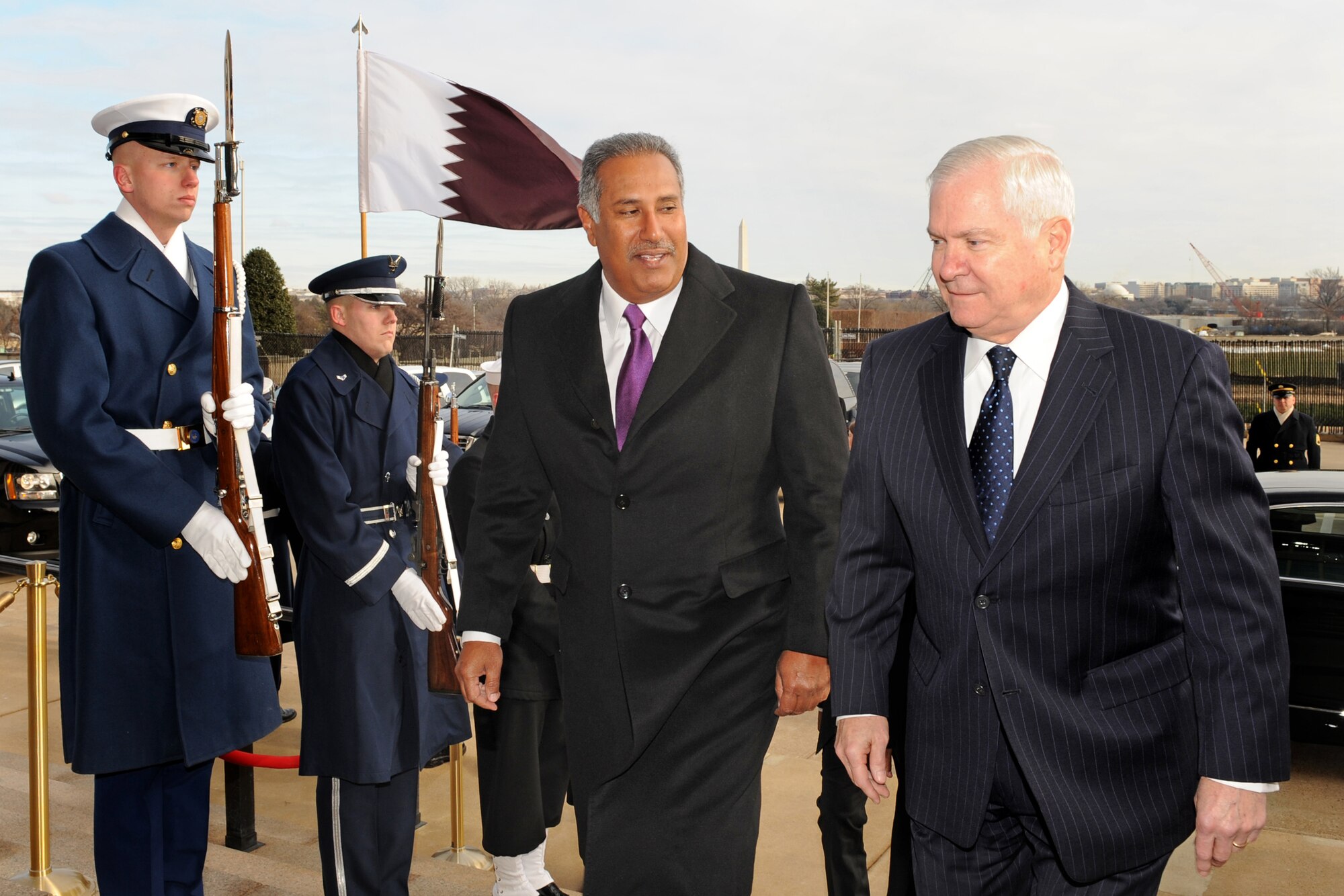 Secretary of Defense Robert M. Gates (right), shown here escorting Qatari Prime Minister Hamad bin Jassim Al-Thani through an honor cordon and into the Pentagon on Jan. 5, 2010, will stay in office for at least another year he has announced.  (Defense Department photo/R.D. Ward)