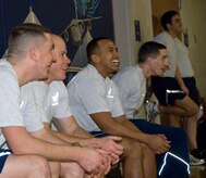 Airmen with the First Term Airmen Center and Airman Leadership School react as their teammates try to avoid being hit during a dodgeball game at the Fitness and Sports Center here Jan. 11. The two organizations hold regular fitness challenges and competitions to promote a positive, team building experience, while boosting the fun of their physical training. (U.S. Air Force photo/Staff Sgt. Daniel Bowles)