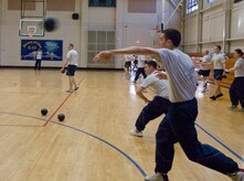 Airman 1st Class David Farthing hurls a ball at the the opposing team during a dodgeball game held at the Fitness and Sports Center here Jan. 11. Airman Leadership School and First Term Airmen Center students and instructors competed together in dodgeball as a fun fitness challenge. Airman Farthing is an FTAC student. (U.S. Air Force photo/Staff Sgt. Daniel Bowles)