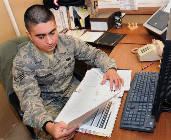 Senior Airman Nelson Vasquez-Guinand sorts due for maintenance forms at a deployed location in the Middle East and was recently recognized as the 506th Air Expeditionary Group's Warrior of the Week. A native of New York, N.Y., Airman Vasquez-Guinand is deployed from the 628th Logistics Readines Squadron here. Airman Vasquez-Guinand is a repair cycle technician with the 506th Expeditionary Logistics Readiness Squadron. (U.S. Air Force photo/Staff Sgt. Tabitha Kuykendall)