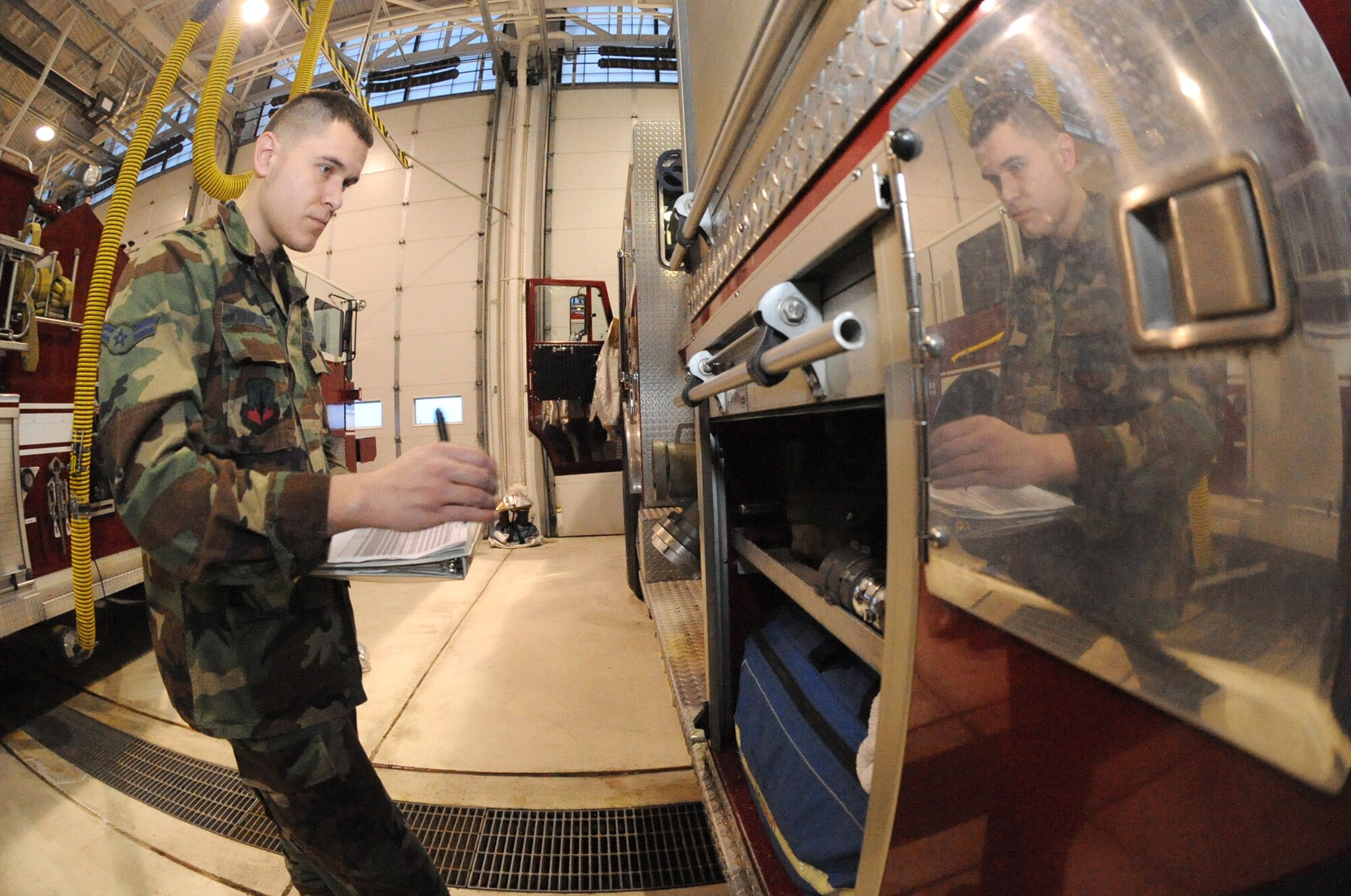 MINOT AIR FORCE BASE, N.D. -- Airman 1st Class Bryan Schroeder, 5th Civil Engineer Squadron fire fighter, performs an equipment check up here Jan 12. Airman Schroeder is one of 11 fire fighters who responded to a call involving an individual who had fallen approximately eight feet into an excavation site off of Glacier Drive in base housing. The fire fighters performed a daring rescue saving the life of a contractor. (U.S. Air Force photo by Senior Airman Jesse Lopez)
