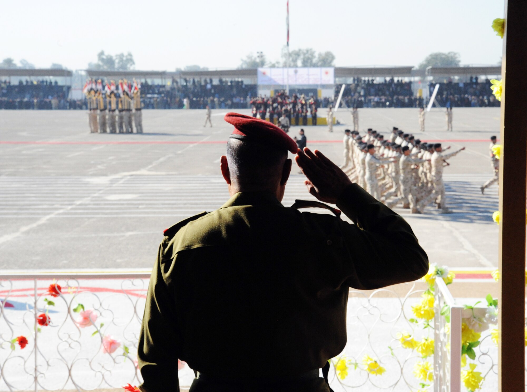 Iraqi staff Gen. Aboud Ganbar salutes cadets during a pass in review at an Iraqi air force officer graduation ceremony Jan. 10, 2010, at the Iraqi Military Academy-Rustamiyah. General Ganbar is the deputy of the Iraqi army chief of staff for operations. (U.S. Air Force photo/Master Sgt. Trish Bunting)