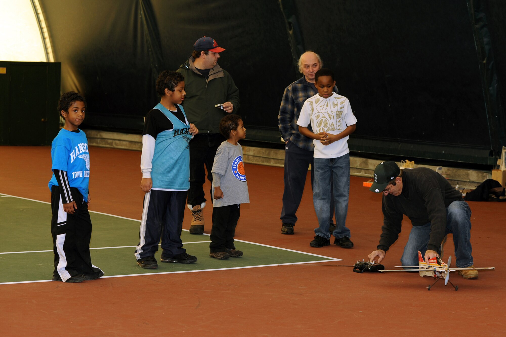 HANSCOM AIR FORCE BASE, Mass. – Members of the Burlington Radio Club took time to demonstrate to members of the Hanscom community, the fun and excitement of remote control airplane flying during a recent demonstration inside the Tennis Bubble.  Club members explained some of the basics of model aircraft flying and the different types of aircraft available.  For more information on upcoming Year of the Air Force Family events call 781-377-2237 (U.S. Air Force photo by Mark Herlihy)