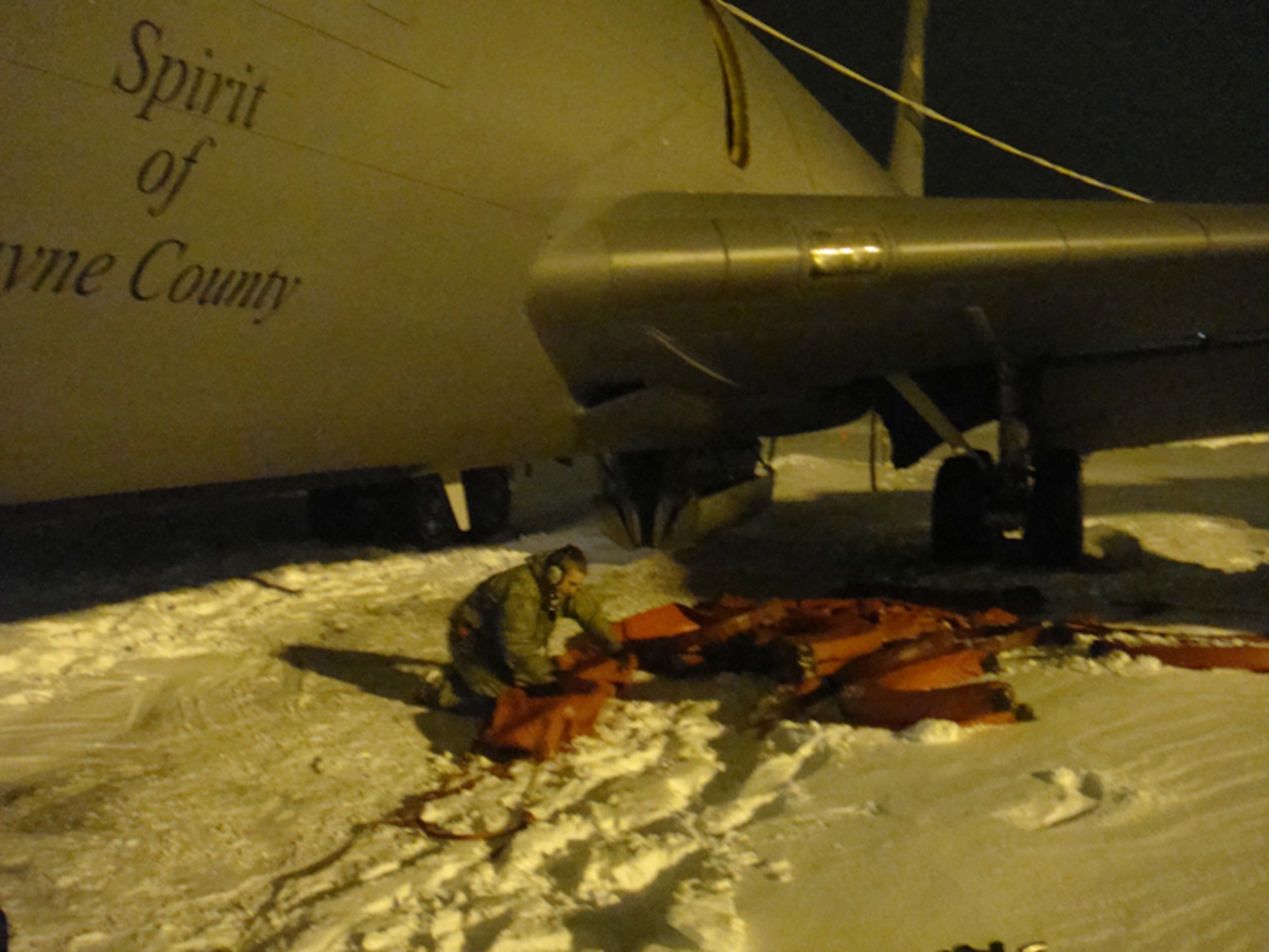 Airman First Class Sean Peck, a maintainer with the 911th Air Refueling Squadron, folds engines covers during a snowstorm that rocked the east coast in mid-December. Airman Peck, along with seven other crew members, conducted aero medical evacuation missions in Afghanistan in late December.          
