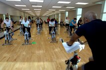 MINOT AIR FORCE BASE, N.D. -- Members of Team Minot take part in a spin class led by Paul Stubbs, 5th Force Support Squadron fitness center director, as part of the Aerobathon at the McAdoo Sports and Fitness Center here Jan. 9. The 5th FSS created the Aerobathon to introduce a variety of aerobic classes offered to base personnel. (U.S. Air Force photo by Senior Airman Michael J. Veloz)