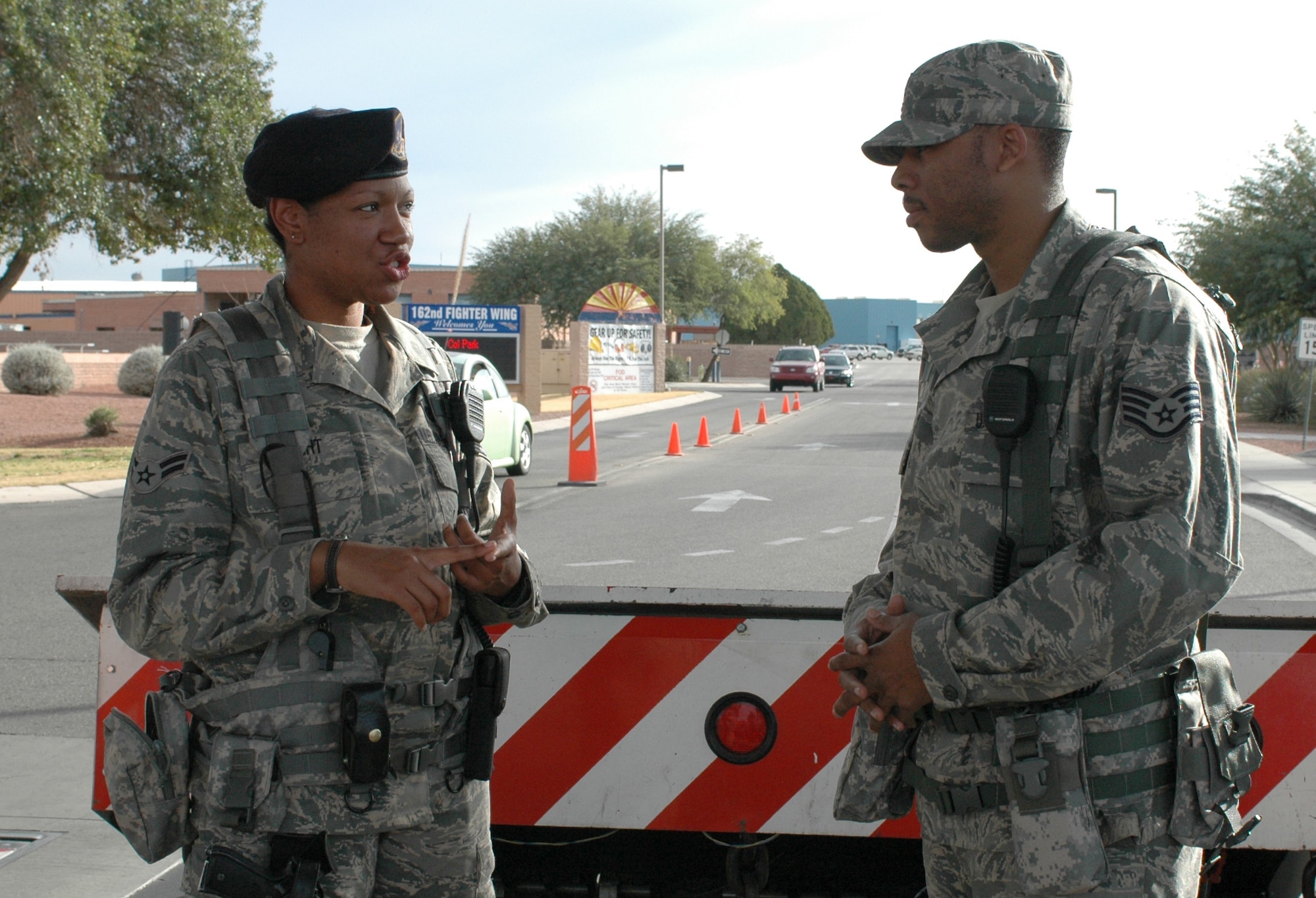 Airman 1st Class Nichole Knight, security forces, instructs Staff Sgt. Virgil Brandy, augmentee, on the eight preconditions for use of deadly force. Sergeant Brandy is one of several part-time Guardsmen who have taken temporary full-time positions to augment the 162nd Security Forces Squadron at Tucson International Airport while 31 regular members are deployed to Iraq. Prior to his temporary assignment Brandy served in the wing’s disaster preparedness section. (U.S. Air Force photo by Staff Sgt. Jordan Jones)