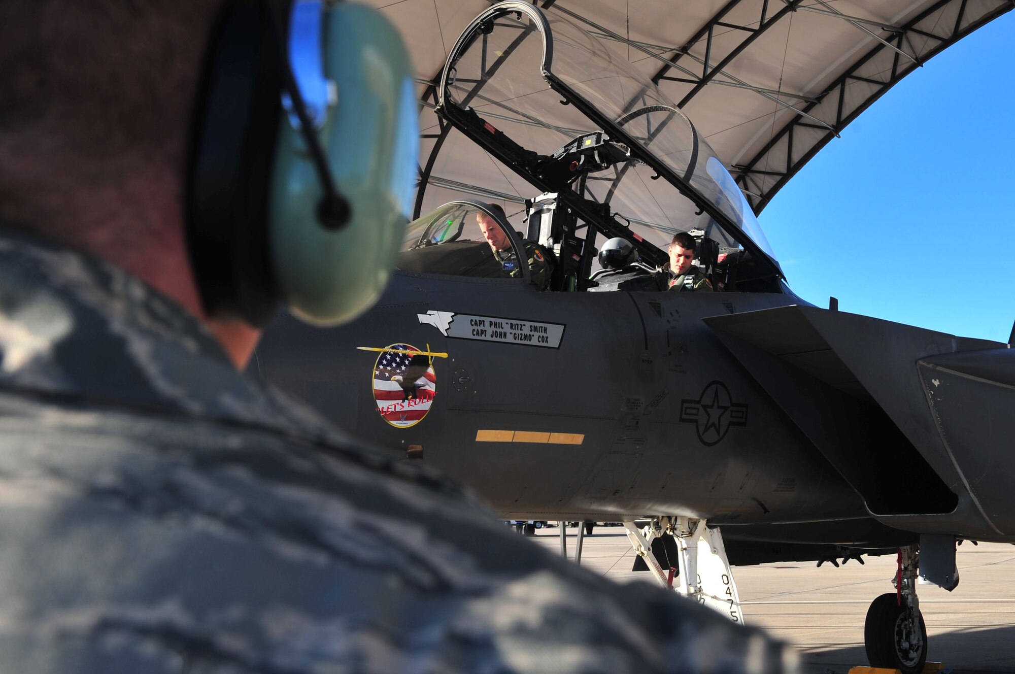 Maj. Michael Maeder and Capt. John Cox, 4th Fighter Wing Strike Eagle Demonstration Team pilot and weapon systems officer, prepare for a practice show on Seymour Johnson Air Force Base, N.C., Jan. 11, 2010. The demonstration team showcases the F-15E around the world at various airshows throughout the year. Maeder hails from Brookville, Fla. and Cox is from Wooster, Ohio. (U.S. Air Force photo/Airman 1st Class Rae Perry)