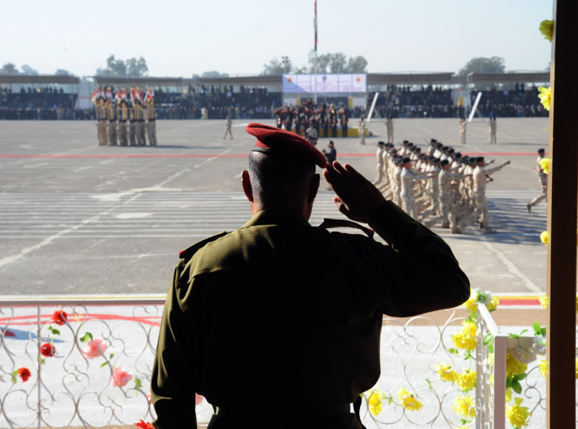 Iraqi Staff General Aboud Ganbar, Deputy of the Iraqi Army Chief of Staff for Operations, salutes cadets during a pass in review at an Iraqi air force officer graduation ceremony on Iraqi Military Academy-Rustamiyah, Iraq, Jan. 10, 2010. In a two month course the 247 graduates at Iraqi Military Academy-Rustamiyah were educated in professionalism, teamwork, management and the leadership skills required to be an officer. (U.S. Air Force photo/Master Sgt. Trish Bunting/Released)