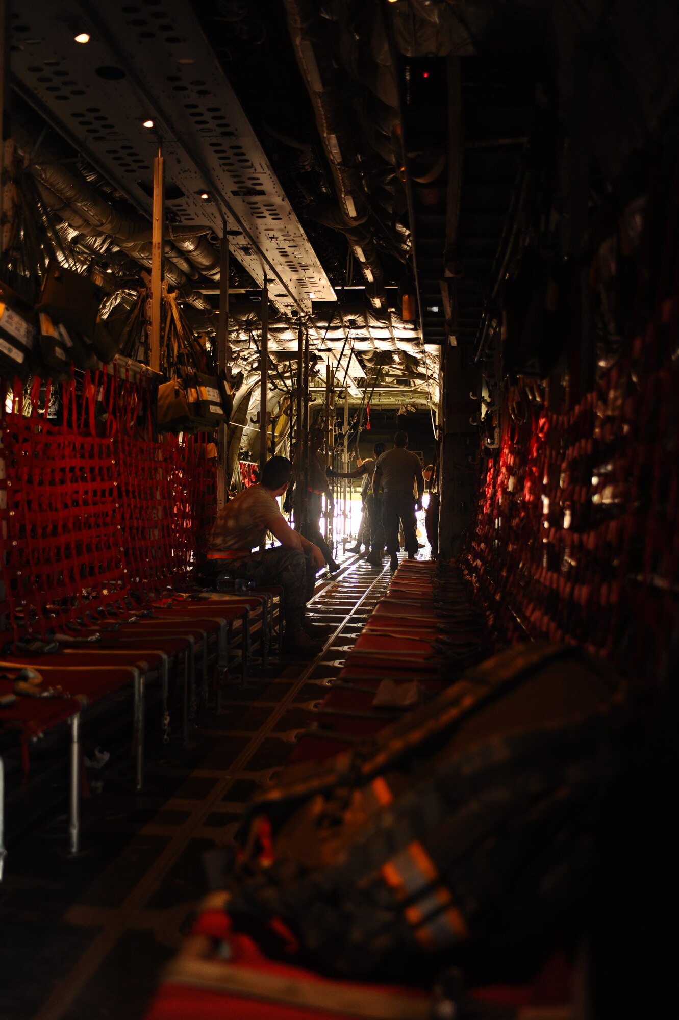 100109-F-3622Z-022
Airmen from the 379th Expeditionary Airlift Evacuation Squadron prepare a C-130 Hercules for a medical evacuation mission at a non-disclosed Southwest Asia location Jan. 9, 2010.  The C-130 can be rapidly reconfigured for the various types of cargo such as palletized equipment, floor-loaded material, airdrop platforms, container delivery system bundles, vehicles and personnel or aeromedical evacuation. (U.S. Air Force photo by Senior Airman Kasey Zickmund)[RELEASED]