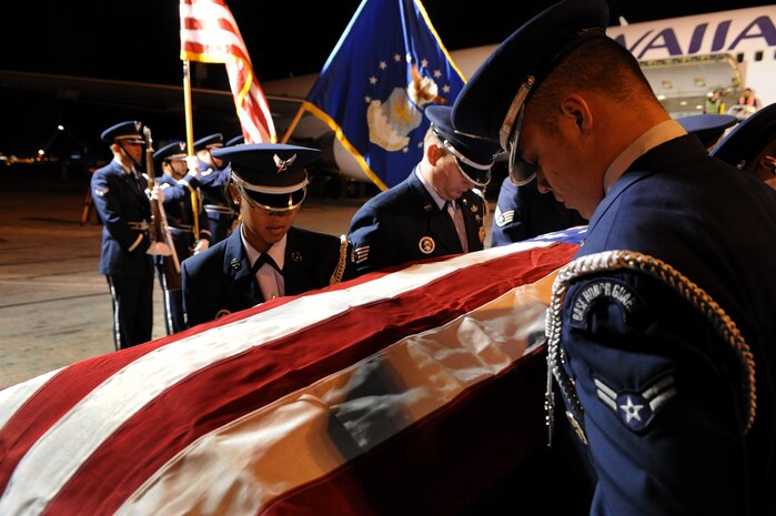 LAS VEGAS -- Members of the Nellis Air Force Base Honor Guard provide a dignified transfer for the remains of Maj. Russell C. Goodman, a U.S. Air Force pilot that was killed in action during the Vietnam War, from a Hawaiian Airlines flight at McCarran International Airport Jan. 12. Major Goodman served as the narrator for the U.S. Air Force Air Demonstration Squadon "Thunderbirds" from 1964-65 and was declared missing in action after his aircraft was hit by a surface-to-air missile Feb. 20, 1967, while on a combat mission over North Vietnam. At the time of his loss, Major Goodman was still assigned to the Thunderbirds and was flying with the U.S. Navy on an exchange program. Funeral services for Major Goodman will take place at the Thunderbirds Hangar on Nellis AFB at 11 a.m. Jan. 14. He is to be buried in Alaska at a date determined by his family. (U.S. Air Force photo by Tech. Sgt. Michael R. Holzworth/RELEASED)