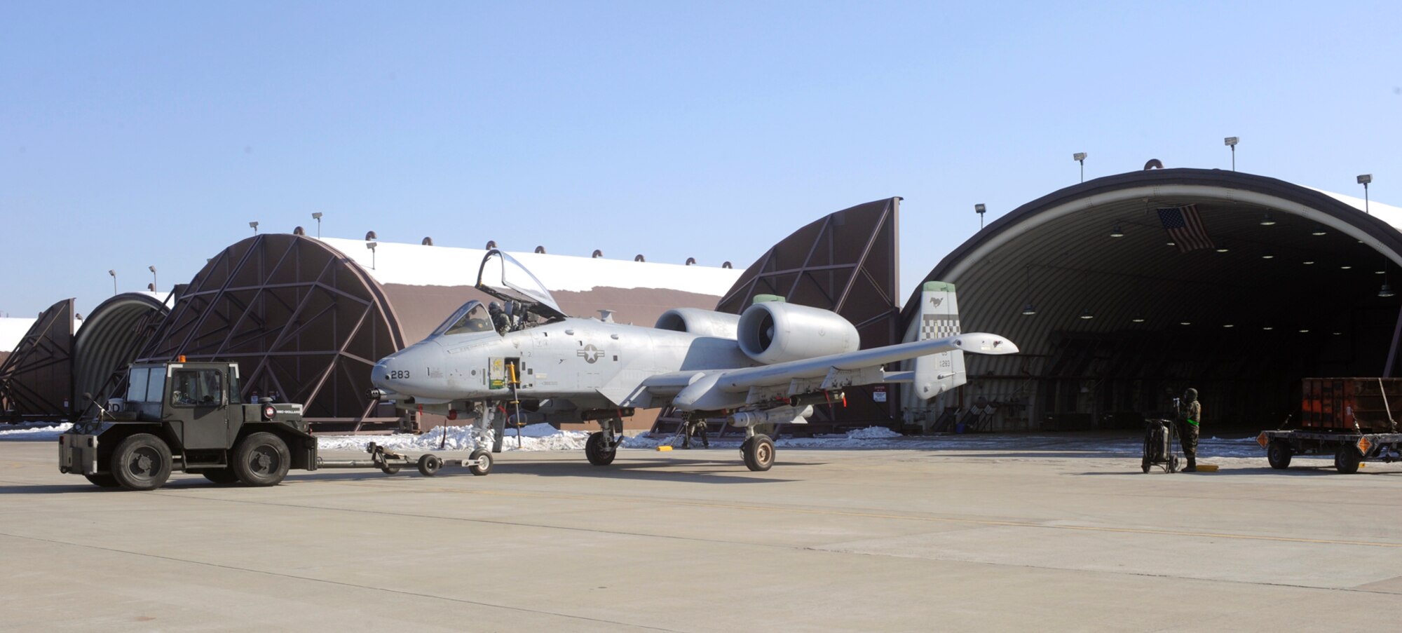 Airmen in Mission Oriented Protective Posture four tow an A-10 into a
25th Fighter Squadron hangar after flight for maintenance during Operational
Readiness Exercise Beverly Bulldog 10-01 at Osan Air Base, Republic of
Korea, Jan. 13. (U.S. Air Force photo/Senior Airman Stephenie Wade)
