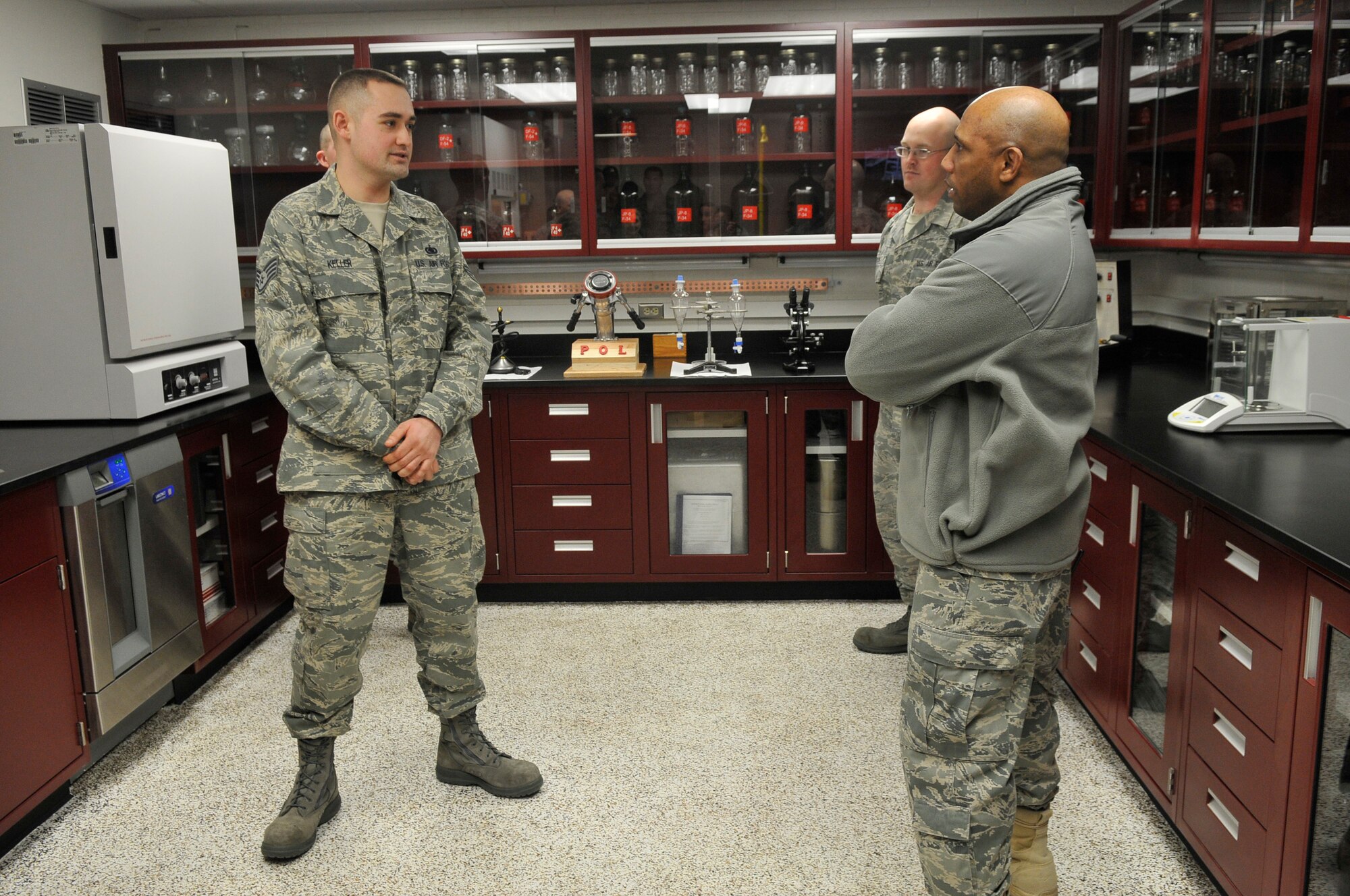 Staff Sgt. Gavin Keller briefs Col. Karlton Johnson on the changes to the renovated laboratory Dec. 15, 2009, at Eielson Air Force Base, Alaska. The lab now allows technicians to work in a larger area. Sergeant Keller is the 354th Logistics Readiness Squadron laboratory technician and Colonel Johnson is the 354th Mission Support Group commander. (U.S. Air Force photo/Airman 1st Class Janine Thibault)