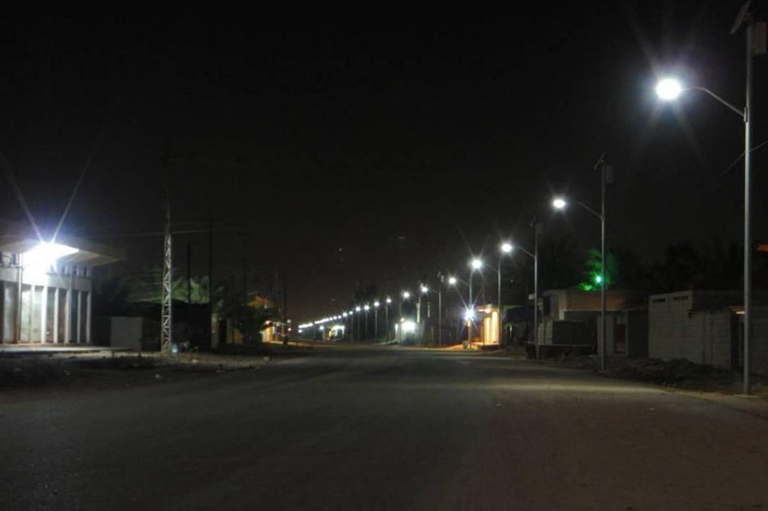 Solar-powered street lights recently installed by the U.S. Army Corps of Engineers illuminate what was once a dark and dangerous neighborhood in Fallujah, Iraq. U.S. Army photo

