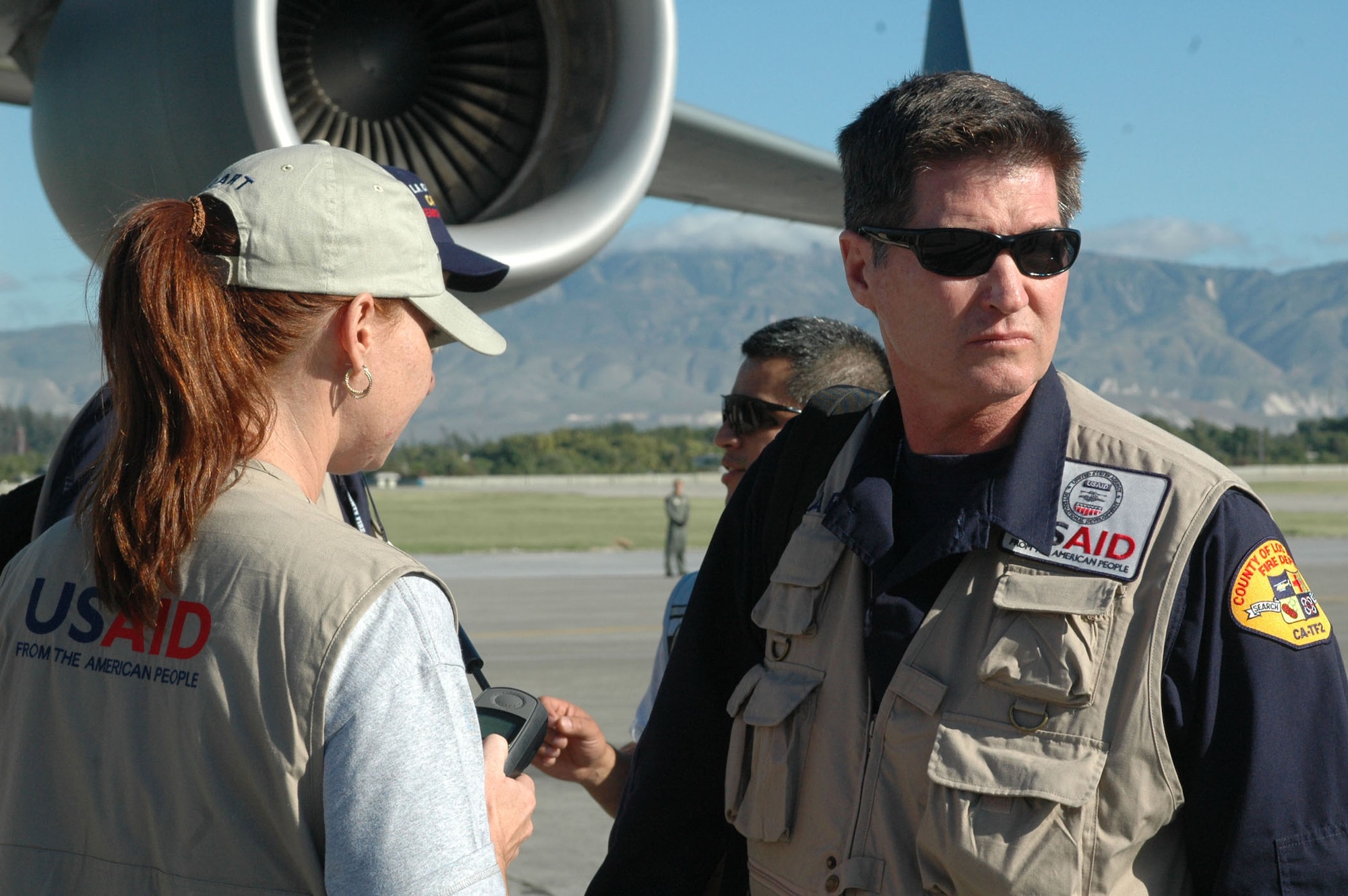 PORT-AU-PRINCE, Haiti -- Terry DeJournett, leader of California Task Force 2, prepares for the upcoming humanitarian search and rescue mission in Haiti. DeJournett arrived Jan. 14 on a C-17 Globemaster III from Travis Air Force Base, Calif. (U.S. Air Force photo/2nd Lt. Holly Hess)