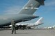 PORT-AU-PRINCE, Haiti -- Senior Airman Jared Mecum, Security Forces Raven team member, guards a C-17 Globemaster III from Travis Air Force Base, Calif., after it landed in Haiti in support of humanitarian relief efforts.  (U.S. Air Force photo/2nd Lt. Holly Hess)