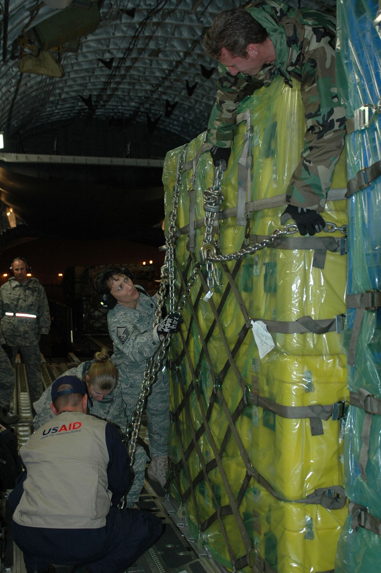 MARCH AIR RESERVE BASE, Calif. -- Airmen from March ARB upload cargo on a C-17 Globemaster III from Travis Air Force Base, Calif., in support of humanitarian efforts in Haiti. (U.S. Air Force photo/2nd Lt. Holly Hess)