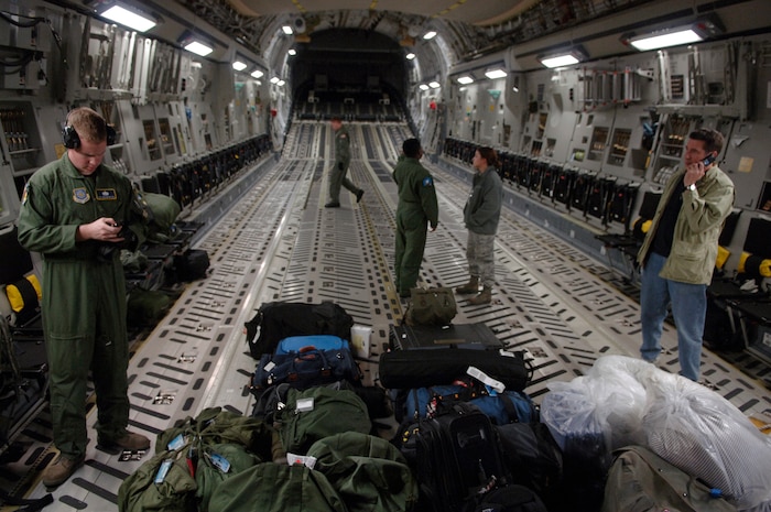 Team Charleston members wait to depart for McGuire Air Force Base, N.J., Jan. 14 to pick up humanitarian supplies to deliver to Haiti following the devastating 7.0 –magnitude earthquake that hit Tuesday morning. The Air Force's airlift capability enables the U.S. to respond immediately to any disaster domestically or worldwide. The U.S. is the only country with an aircraft fleet capable of providing this type of response. (U.S. Ai r Force photo/ Airman 1st Class Lauren Main)