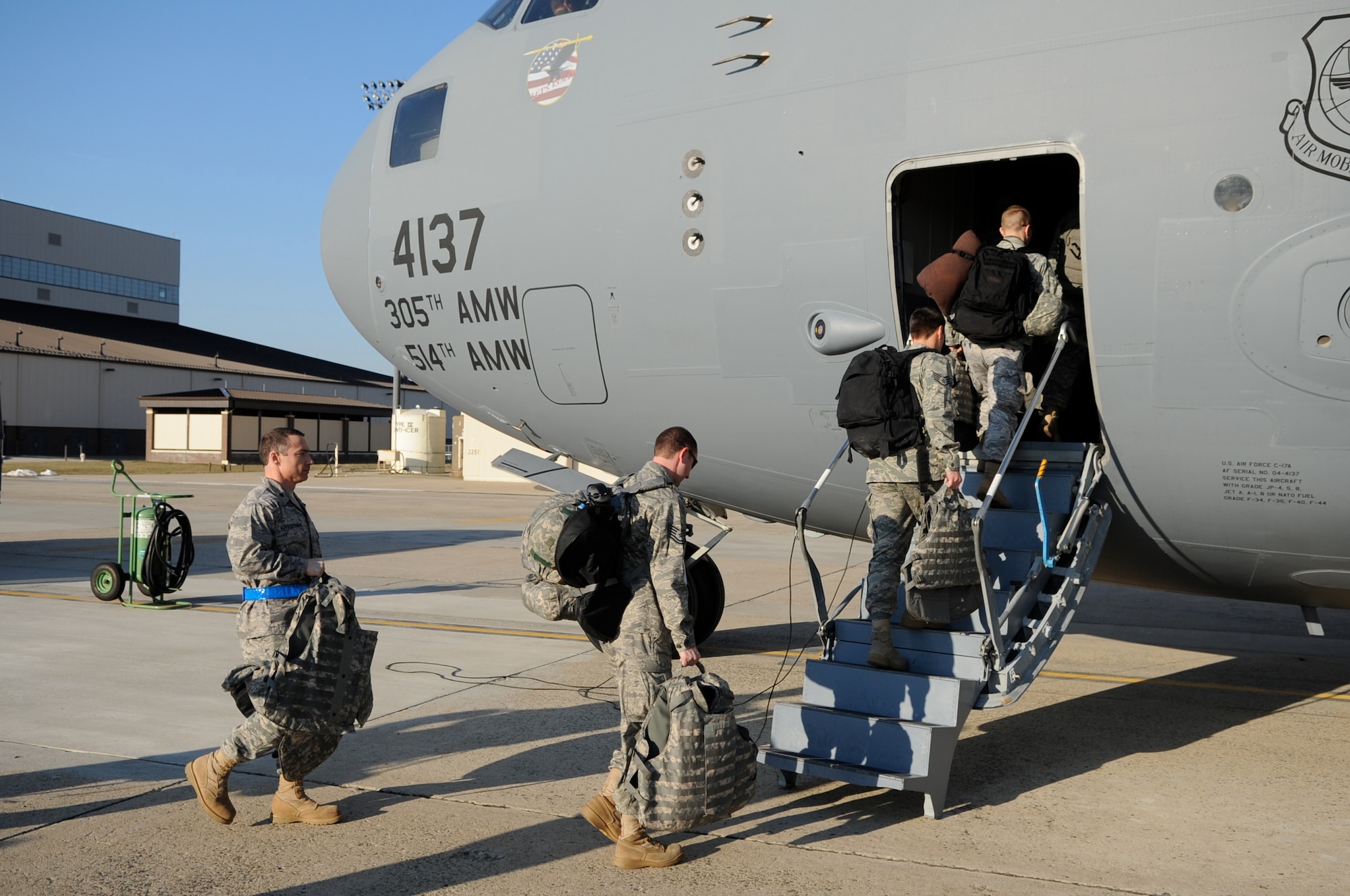 Airmen assigned to the 621st Contingency Response Wing, 514 Air Mobility Wing, and 305th Air Mobility Wing at Joint Base McGuire-Dix-Lakehurst boarded a C-17 Globemaster III earlier today in support of Haiti Humanitarian Relief Operations. (U.S. Air Force Photo/Charles Russell)  