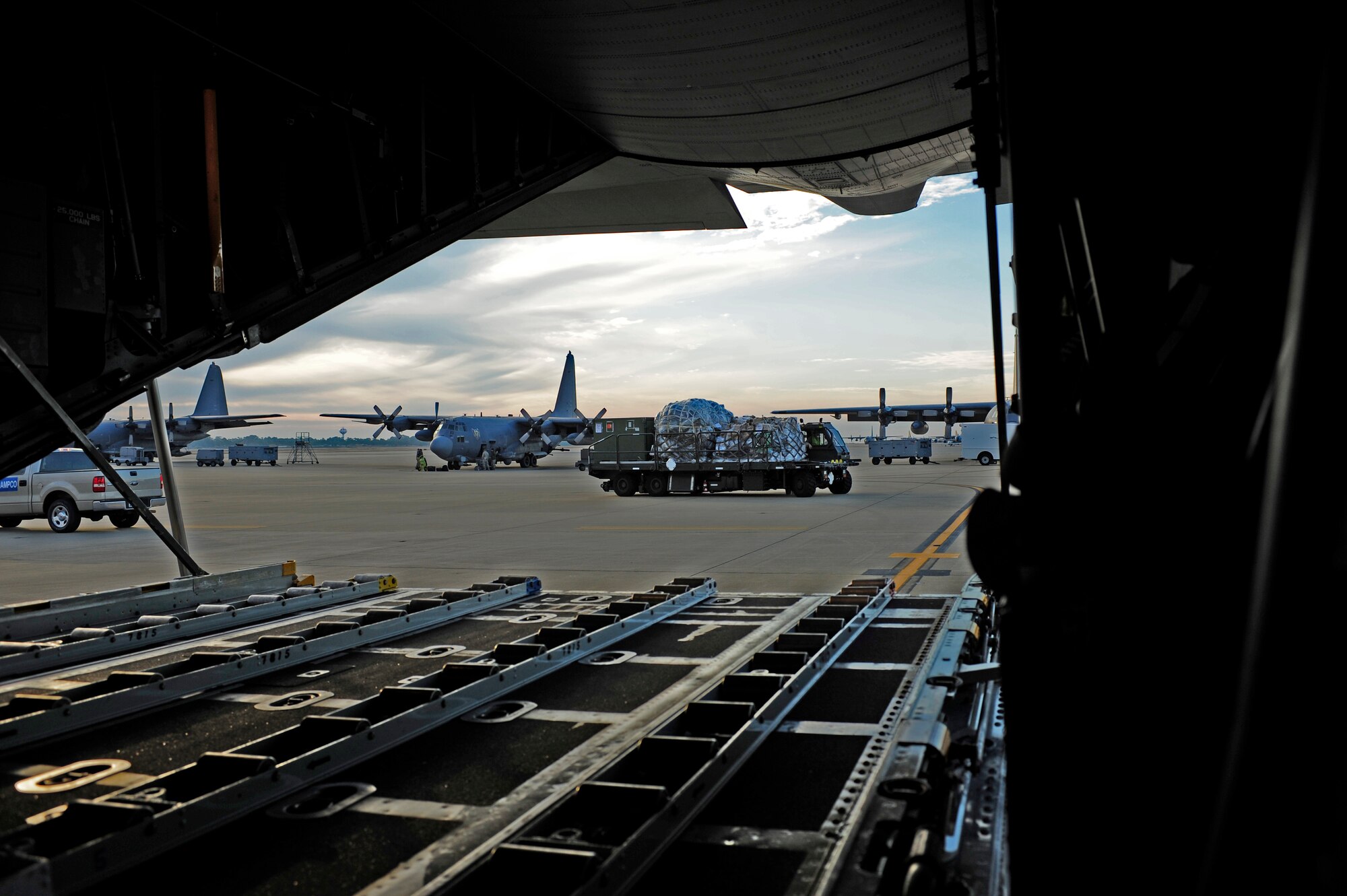 Cargo is prepped to be loaded onto a C-130 Hercules at Hurlburt Field, Fla., Jan. 14, 2010, for transport to Haiti in support of humanitarian operations.  The U.S. Air Force is providing humanitarian assistance and disaster relief to Haiti after a magnitude 7 earthquake hit the country on Jan. 12, 2010.  U.S. Air Force photo by Tech. Sgt. James L. Harper Jr.

