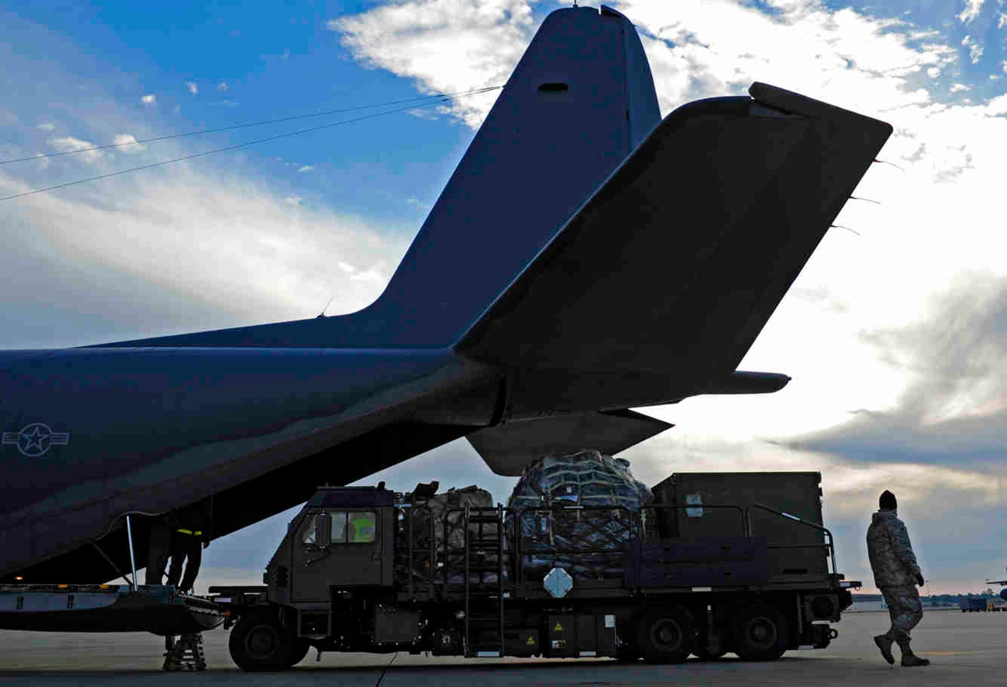 Cargo is loaded onto a C-130 Hercules at Hurlburt Field, Fla., Jan. 14, 2010, for transport to Haiti in support of humanitarian operations.  The U.S. Air Force is providing humanitarian assistance and disaster relief to Haiti after a magnitude 7 earthquake hit the country on Jan. 12, 2010.  U.S. Air Force photo by Tech. Sgt. James L. Harper Jr.
