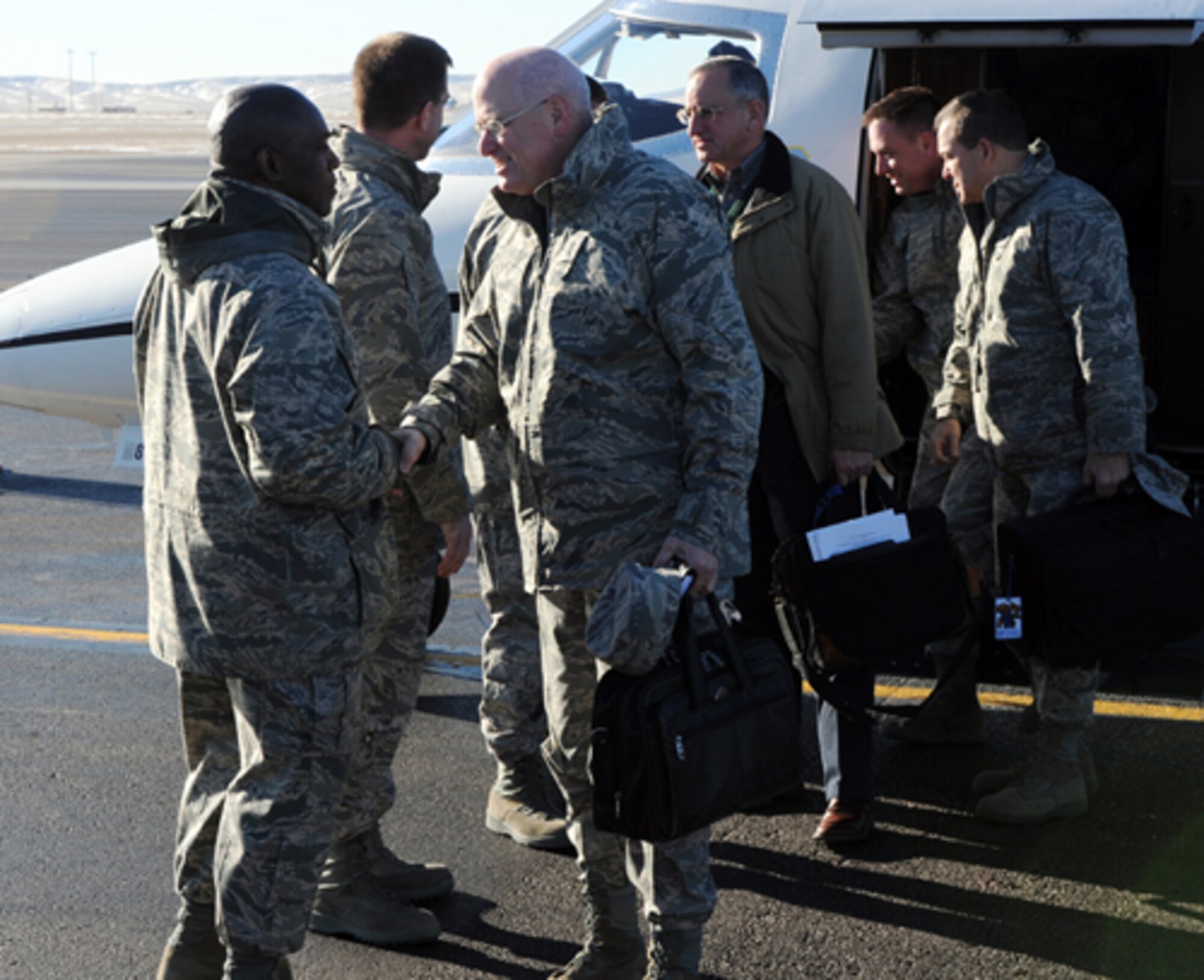 ELLSWORTH AIR FORCE BASE, S.D. – (Right) Lt. Gen. Loren M. Reno, Deputy Chief of Staff for Logistics, Installations and Mission Support, is greeted upon landing here, by Chief Master Sergeant Clifton Cole, 28th Bomb Wing command chief, Jan. 12. Ellsworth was the first detour in General Reno’s tour of the Northern tier bases; the purpose of his tour is to visit the Airmen. (U.S. Air Force photo/Airman 1st Class Adam Grant)


