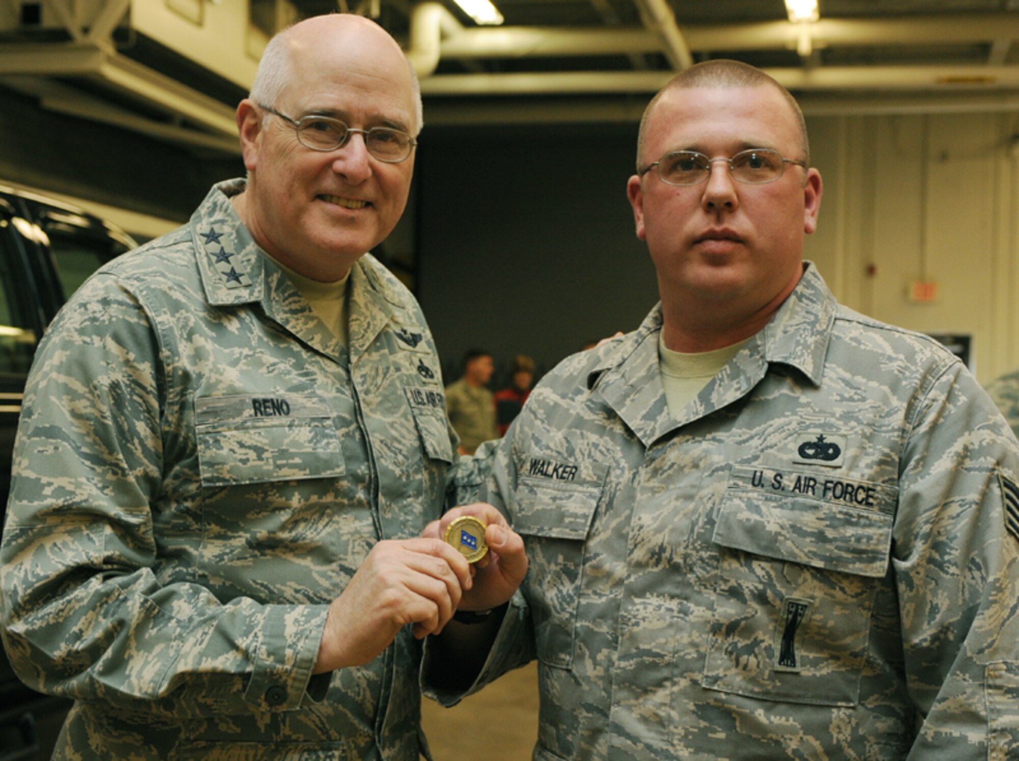 ELLSWORTH AIR FORCE BASE, S.D. – (Left) Lt. Gen. Loren M. Reno, Deputy Chief of Staff for Logistics, Installations and Mission Support, poses for a photo with Staff Sgt. Terry Walker, 28th Logistics and Readiness Squadron vehicle control operator, Jan. 12. Sergeant Walker was coined for his efforts in the finding of Mattracks, a rubber track conversion system placed on 4x4 vehicles in place of tires, which saved the Air Force a total of $456,000. (U.S. Air Force photo/Airman 1st Class Adam Grant)

