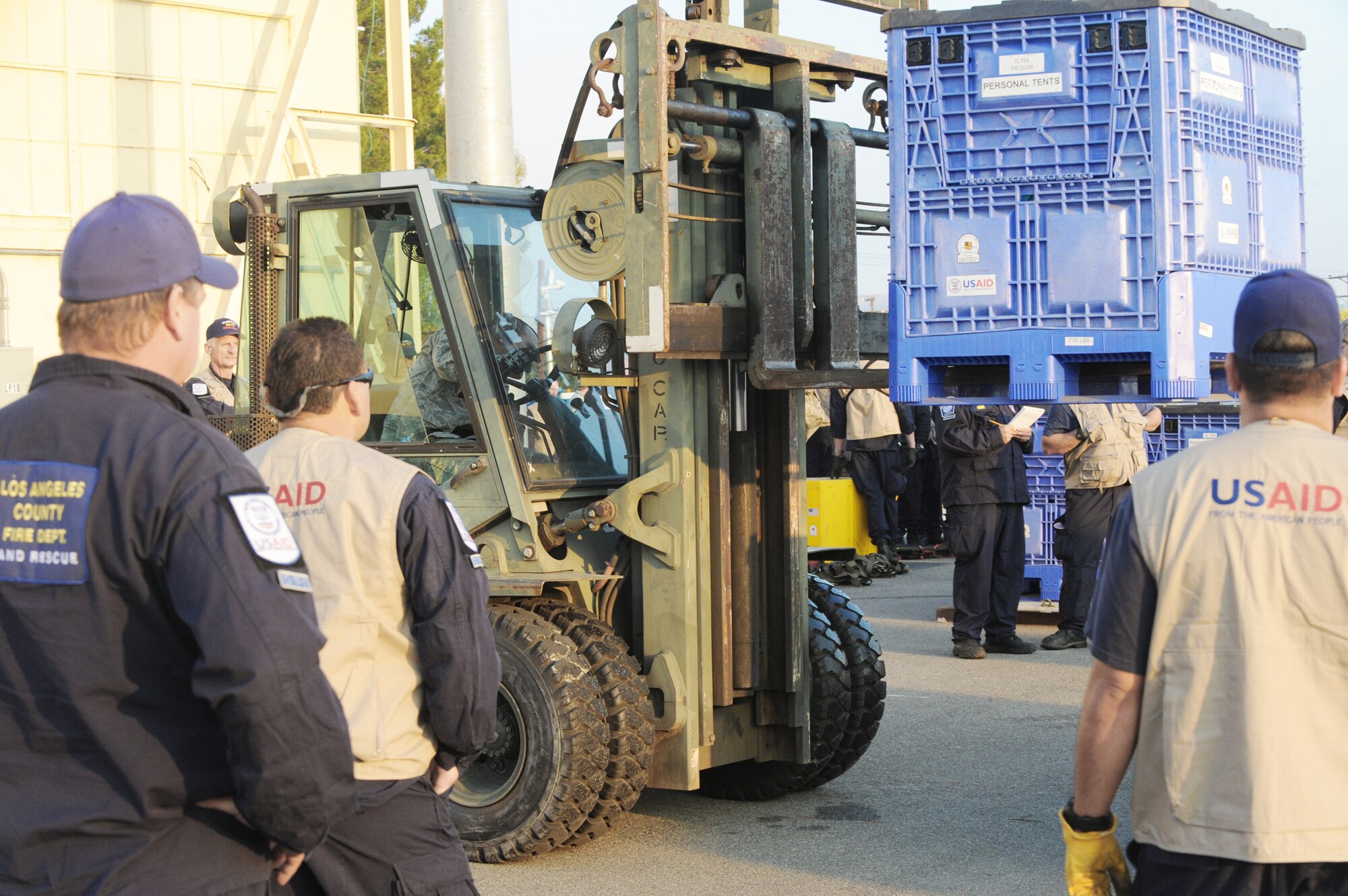Relief workers and search and rescue teams use March Air Reserve Base, Calif., as a staging area to assemble supplies, people and equipment Jan. 13, 2010, following the recent 7.0-magnitude earthquake in Haiti. All will be loaded on a C-17 Globemaster III and flown into Port-au-Prince, Haiti. The aircraft is assigned to the 60th Air Wing at Travis Air Force Base, Calif., (U.S. Air Force photo/Master Sgt. Roy Santana)