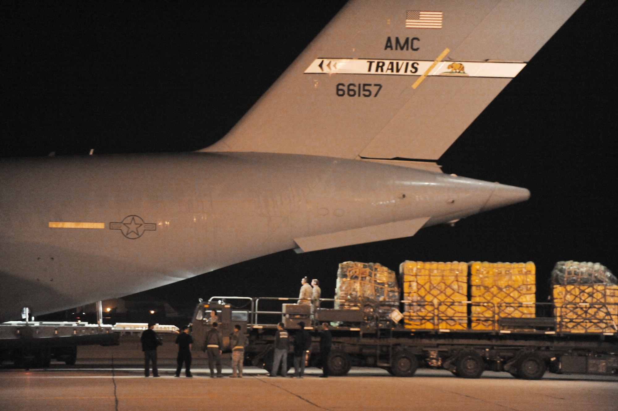 Relief workers and search and rescue teams use March Air Reserve Base, Calif., as a staging area to assemble supplies, people and equipment Jan. 13, 2010, following the recent 7.0-magnitude earthquake in Haiti. All will be loaded on a C-17 Globemaster III and flown into Port-au-Prince, Haiti. The aircraft is assigned to the 60th Air Wing at Travis Air Force Base, Calif., (U.S. Air Force photo/Master Sgt. Roy Santana)