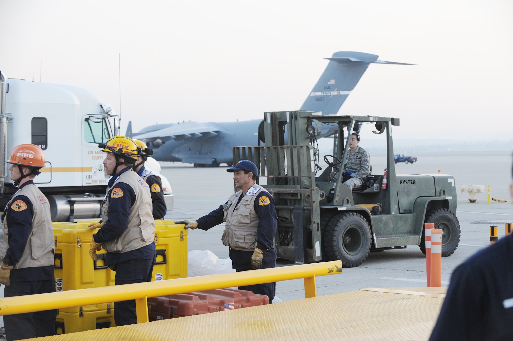 Relief workers and search and rescue teams use March Air Reserve Base, Calif., as a staging area to assemble supplies, people and equipment Jan. 13, 2010, following the recent magnitude 7 earthquake in Haiti. All will be loaded on a C-17 Globemaster III and flown into Port-au-Prince, Haiti. The aircraft is assigned to the 60th Air Wing at Travis Air Force Base, Calif. (U.S. Air Force photo/Master Sgt. Roy Santana)
