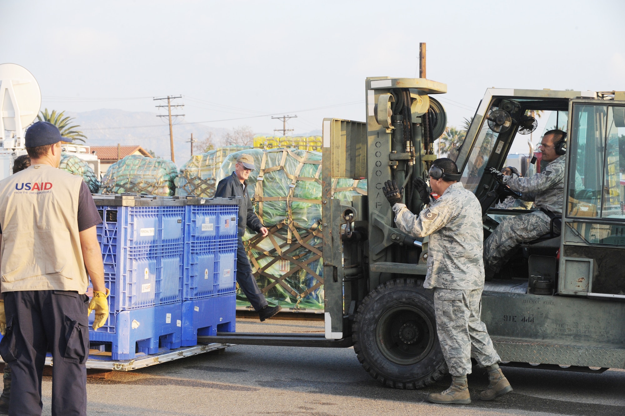 Relief workers and search and rescue teams use March Air Reserve Base, Calif., as a staging area to assemble supplies, people and equipment Jan. 13, 2010, following the recent  7.0-magnitude earthquake in Haiti. All will be loaded on a C-17 Globemaster III and flown into Port-au-Prince, Haiti. The aircraft is assigned to the 60th Air Wing at Travis Air Force Base, Calif., (U.S. Air Force photo/Master Sgt. Roy Santana)
