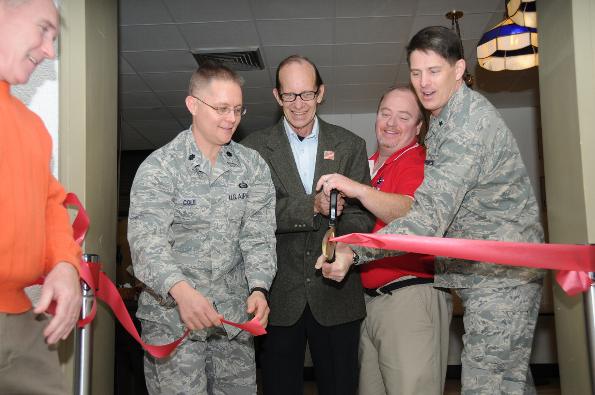 From left, Tom Golden, community services flight chief for the 81st Force Support Squadron; Lt. Col. Richard Cole, 81st FSS commander; Terry Janca, representing the Gaudé family; Bart Bosarge, bowling center manager, and Brig. Gen. Ian Dickinson, 81st Training Wing commander, cut the ribbon reopening Gaudé Lanes Bowling Center Jan. 12.  (U.S. Air Force photo by Kemberly Groue)
