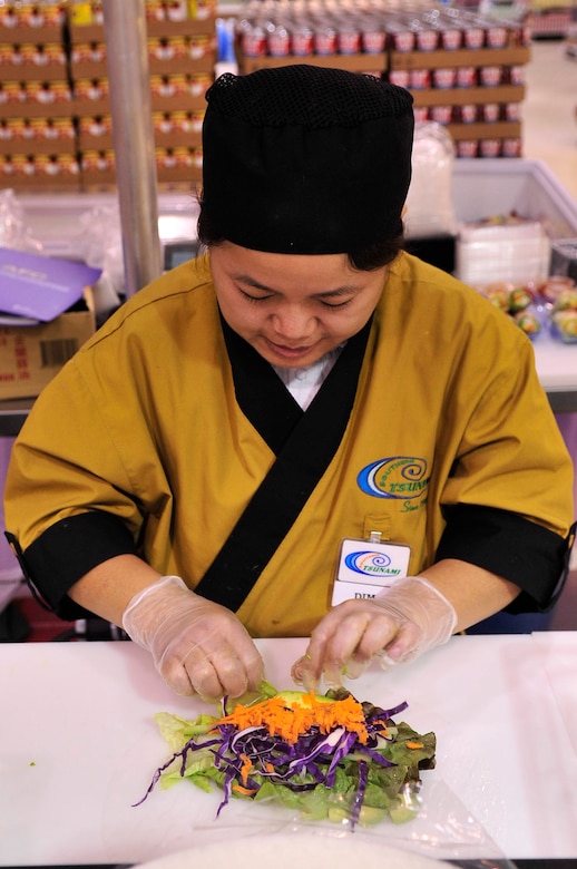BUCKLEY AIR FORCE BASE, Colo.-- Naum Dim rolls sushi at the Buckley Commissary Jan. 13. Sushi is made fresh everyday. (U.S. Air Force photo by Airman 1st Class Manisha Vasquez)