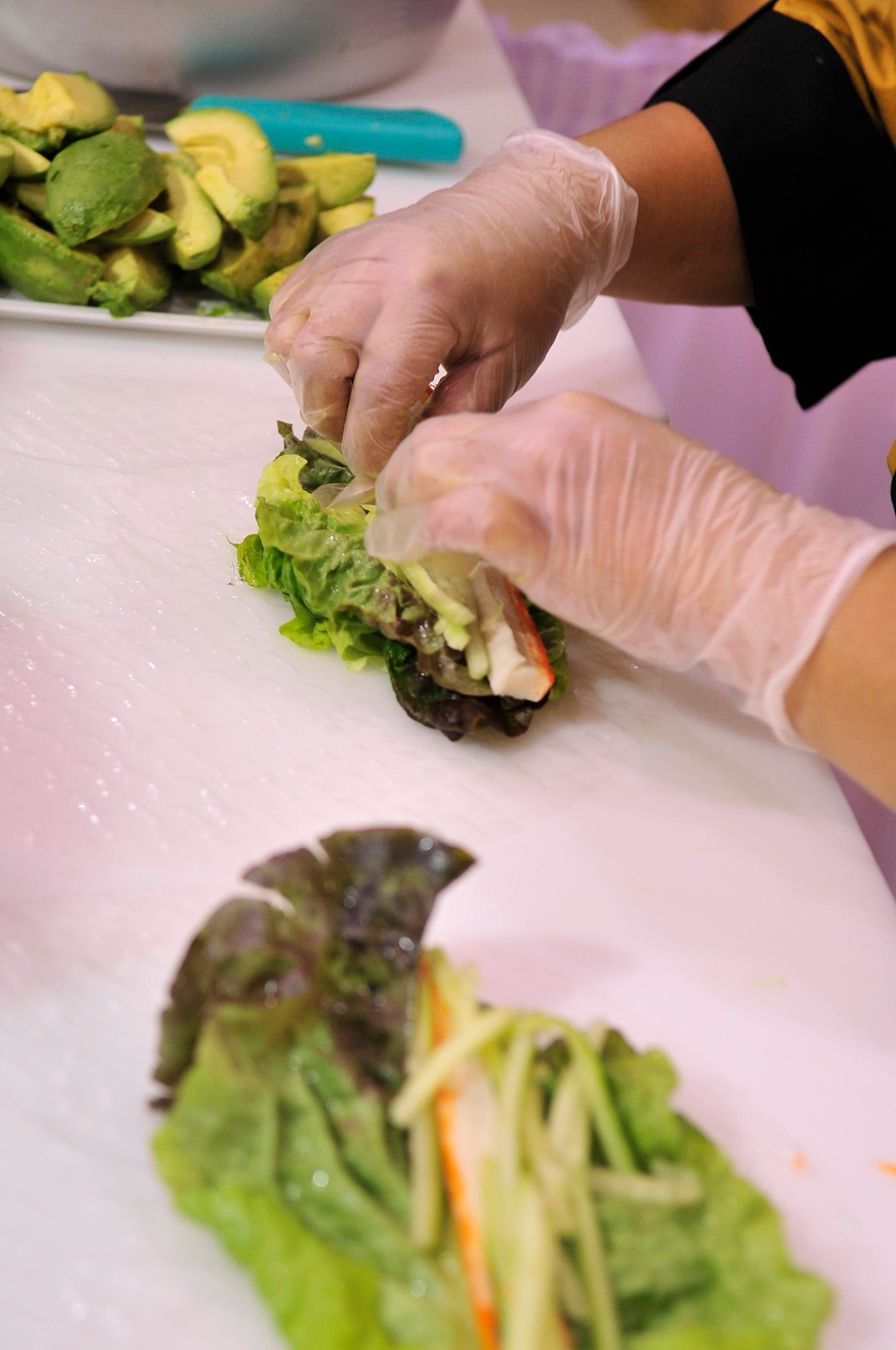 BUCKLEY AIR FORCE BASE, Colo.-- Naum Dim begins her sushi creations at the Commissary Jan. 13. Ms. Dim has been in the sushi business since 2001. (U.S. Air Force photo by Airman 1st Class Manisha Vasquez)
