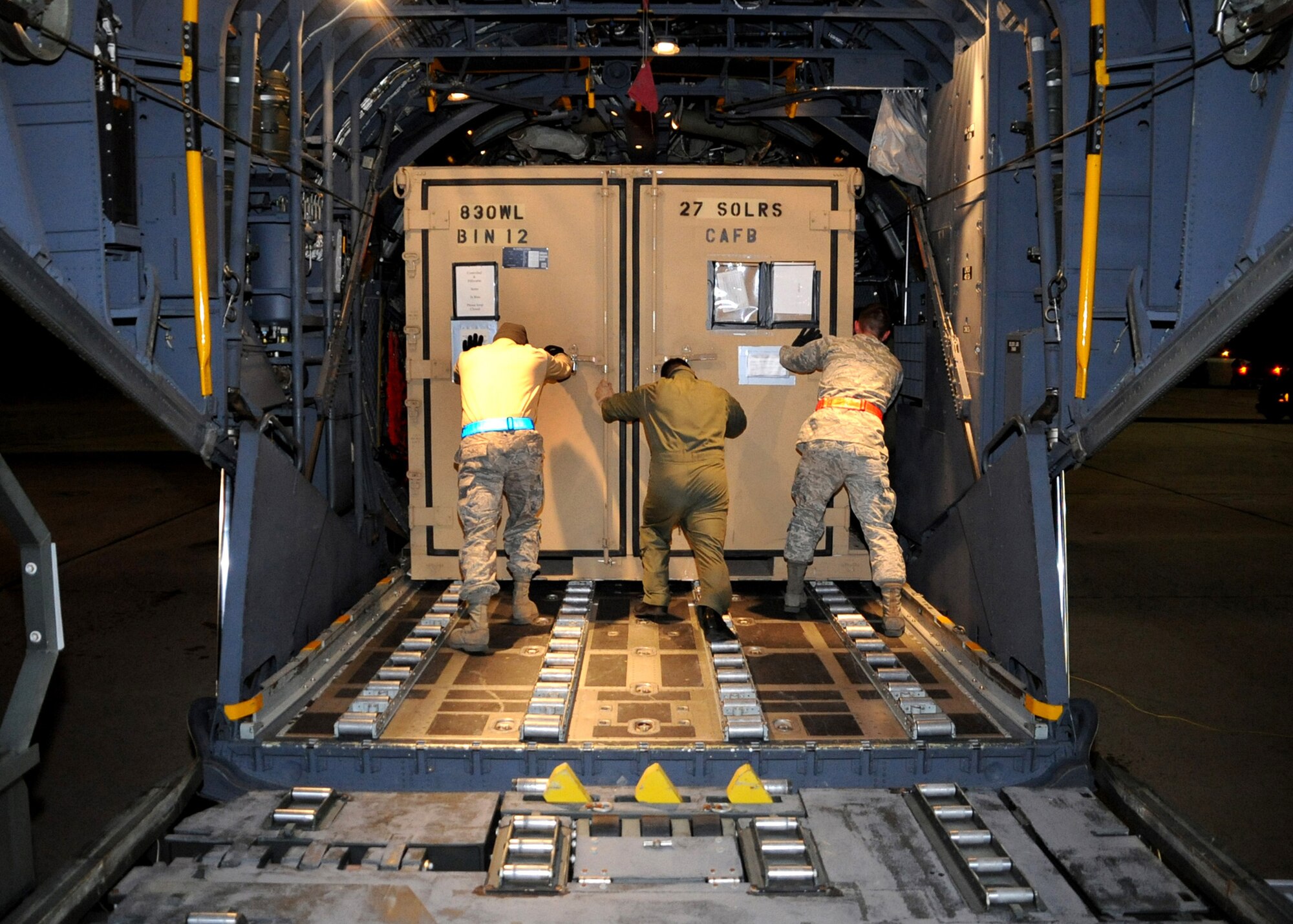 CANNON AIR FORCE BASE, N.M. -- 27th Special Operations Logistics Readiness Squadron Airmen load cargo onto an MC-130W Combat Spear Jan 13.Two aircraft and about 40 Airmen departed in support of earthquake relief efforts in Haiti.  (U.S. Air Force photo by Airman 1st Class Maynelinne De La Cruz)