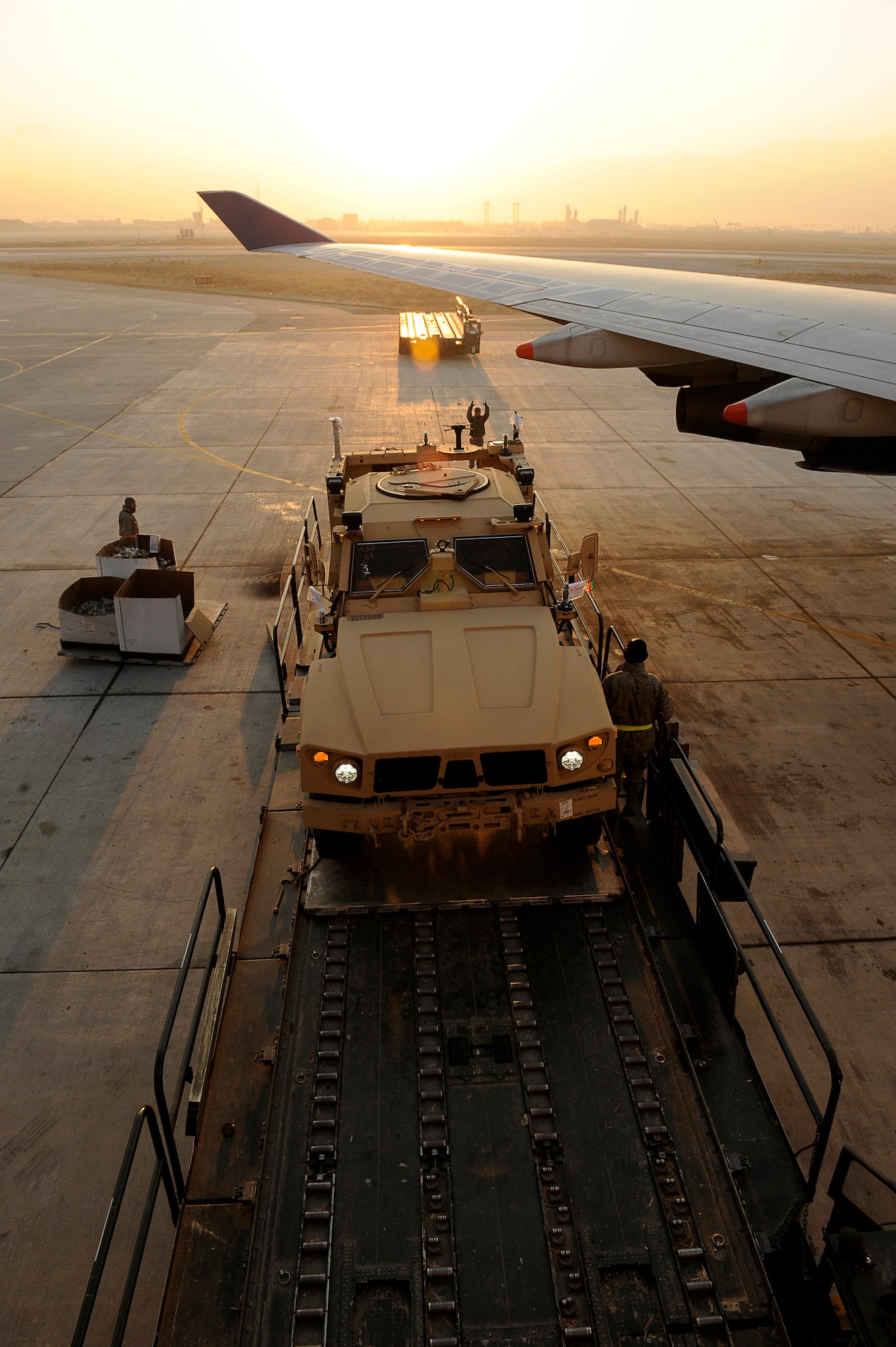 BAGRAM AIRFIELD, Afghanistan-- U.S. Air Force Airmen from the 455th Expeditionary Aerial Port Squadron, unload Mine Resistant Ambush Protected-All Terrain Vehicles (M-ATV) at Bagram Airfield Jan. 13, 2010.  The M-ATV is the latest combat vehicle used by U.S. combat forces. (U.S. Air Force photo by: Tech. Sgt. Jeromy K. Cross)
