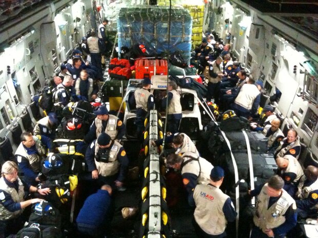 An Air Mobility Command C-17 Globemaster III from Travis Air Force Base, Calif., departs March Air Reserve Base, Calif., Jan. 13 en route to Haiti with U.S. AID support and supplies.  AMC forces are actively working to support relief operations in Haiti after a 7.0-magnitude earthquake devastated the Caribbean nation Jan. 12.  AMC identified several of its C-17 and C-130 cargo aircraft for the relief operations according to officials, posturing them for immediate support. Additional aircraft will be made available as relief requirements become better known.  Mission planning and command-and-control for the AMC portion of the humanitarian effort will be led by the 618th Tanker Airlift Control Center at Scott AFB, Ill.  In addition to supporting U.S. warfighters in Iraq and Afghanistan, the 618th TACC can transition at a moment's notice to support emerging global situations, including humanitarian airlift and aeromedical evacuation.