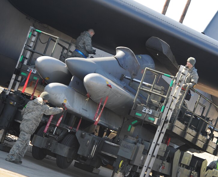 Barksdale AFB, La. -  Members from 2d Aircraft Maintenance Squadron load a munition on a B-52H Stratofortress during a no-notice Nuclear Surety Inspection Jan. 9. An NSI is designed to evaluate a unit's ability to execute nuclear operations ina safe, secure and reliable manner. (U.S. Air Force photo by Senior Airman Alexandra Longfellow) (RELEASED)