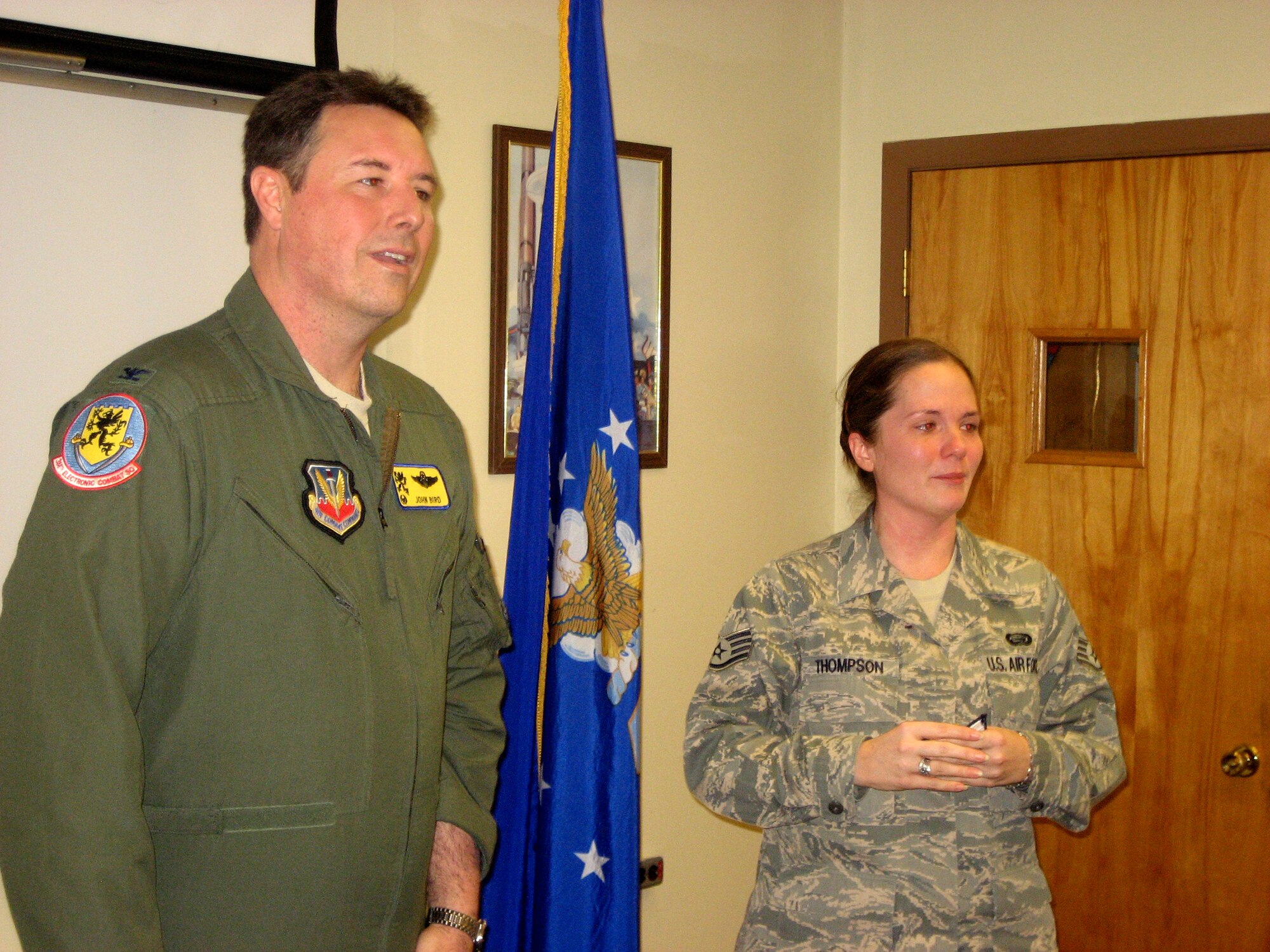 Staff Sgt. Candace Thompson, 388th Electronic Combat Squadron, accepts her STEP promotion to technical sergeant from Col. John Bird, 366th Fighter Wing commander, during a ceremony at Whidbey Island Naval Air Station, Wash., Jan. 7.   STEP stands for Air Force Stripes Awarded for Exceptional Performers, and promotions are awarded to enlisted individuals whose work performance stands out from their co-workers. (Courtesy photo)