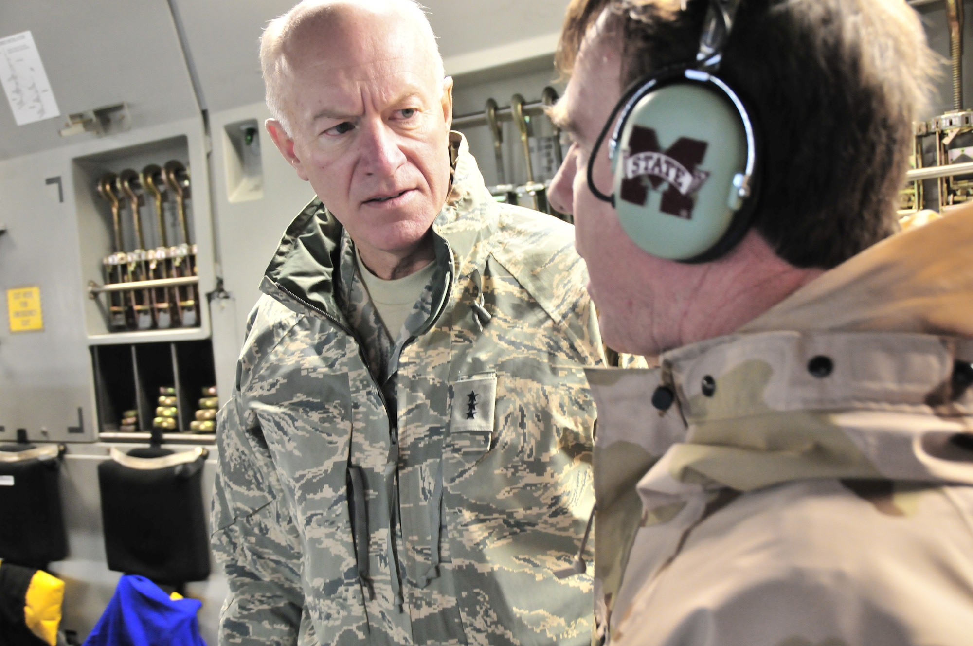 Lt. Gen. Harry Wyatt III, director of the Air National Guard, is briefed by a pilot with the Mississippi Air Guard Jan. 8 aboard a Mississippi Guard C-17 Globemaster III en route to San Antonio, Texas. The flight transported more than 50 patients to the United States as part of its regular aeromedical evacuation missions from Iraq and Germany. Wyatt also visited Airmen at the 172nd in Jackson, Miss., and then at the 186th Air Refueling Wing at Key Field, Miss., Jan. 9 to gain a better understanding of their missions. (U.S. Air Force photo by Master Sgt. Mike R. Smith, National Guard Bureau) (Released)