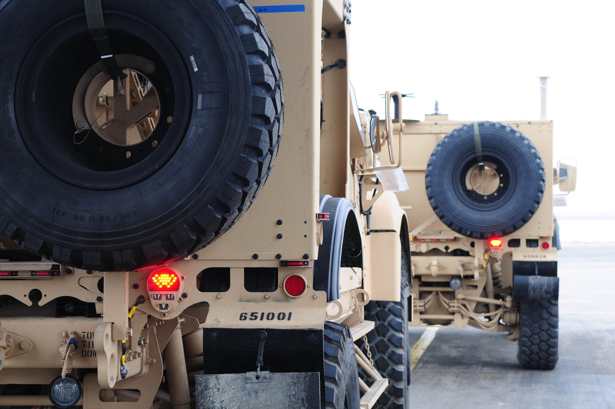 TRANSIT CENTER AT MANAS, Kyrgyzstan - Several MRAP-all terrain vehicles are loaded into a C-17 Globemaster III prior to shipment to Afghanistan. Several C-17s provide airlift for military servicemembers and cargo. (U.S. Air Force photo by Senior Airman Isaac Garden)